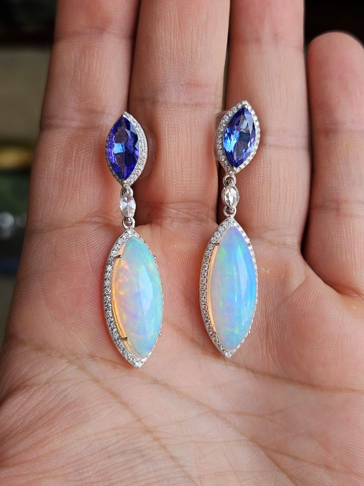 A very gorgeous and beautiful, modern style, Tanzanite & Opal Chandelier Earrings set in 18K White Gold & Diamonds. The weight of the Tanzanites is 2.82 carats. The marquise shaped Tanzanites are responsibly sourced from Tanzania. The weight of the