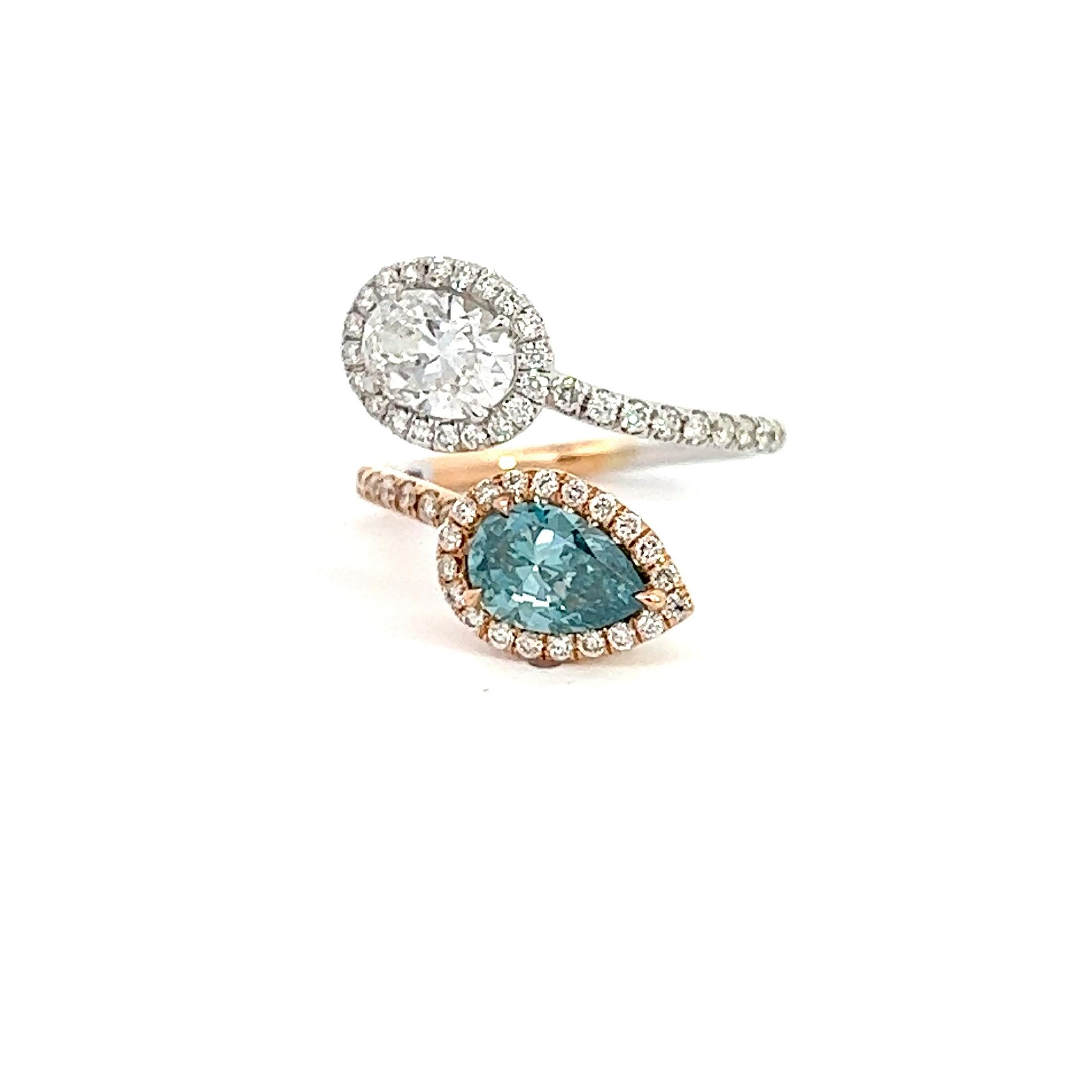 Experience the unmatched beauty of a rare 1.03-Carat Earth Diamond Fancy Blue, Clarity VS2,  PEAR Diamond, expertly accented with round brilliant diamonds and set in lustrous 18K Rose Gold. Then, to make this ring elevate your style even further it