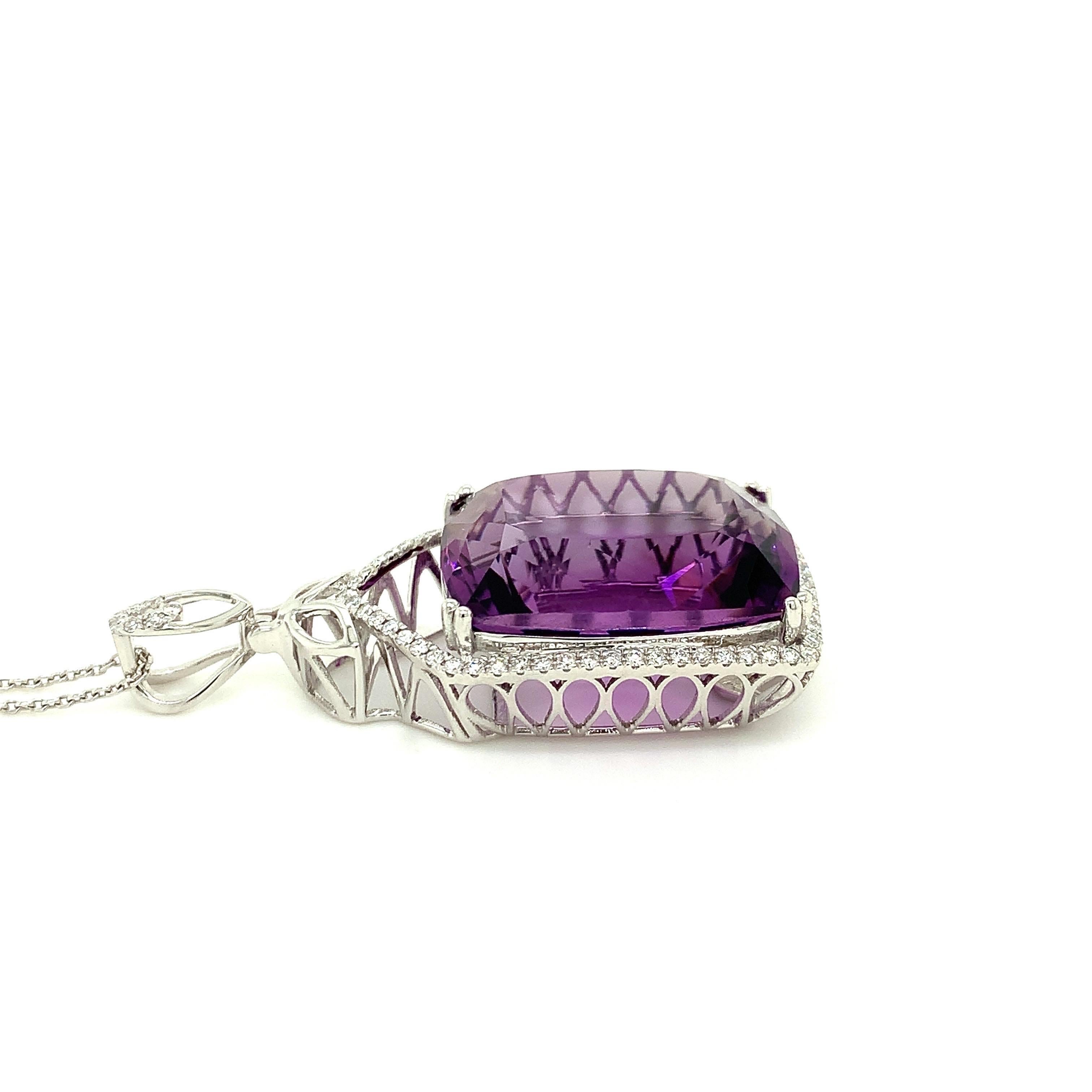 Glamorous pendant. High brilliance, cushion faceted, rich vibrant purple tone natural 28.24 carats amethyst mounted in high profile open basket with eight bead prongs, accented with round brilliant cut diamonds. Handcrafted master piece set in 14