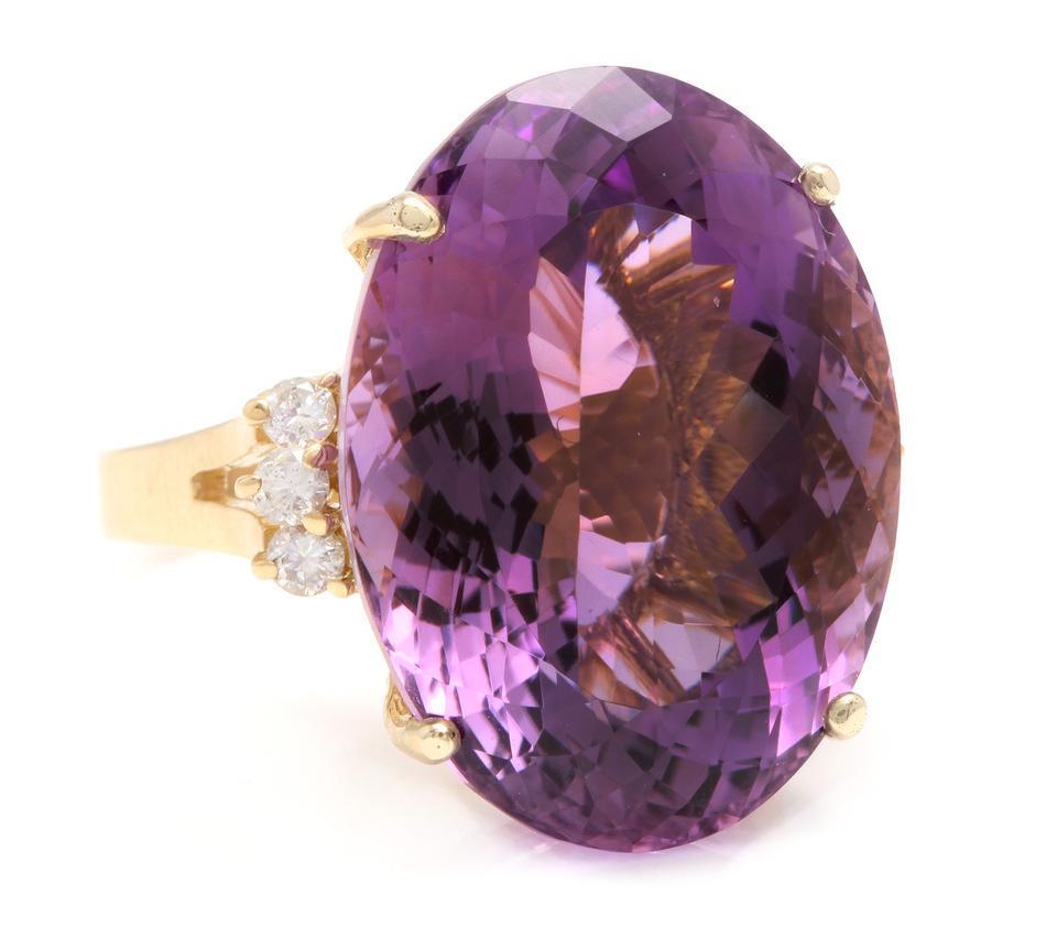 28.25 Carats Natural Amethyst and Diamond 14K Solid Yellow Gold Ring

Total Natural Oval Shaped Amethyst Weights: 28.00 Carats

Amethyst Measures: Approx. 23.50 x 17.00mm

Natural Round Diamonds Weight: 0.25 Carats (color G-H / Clarity