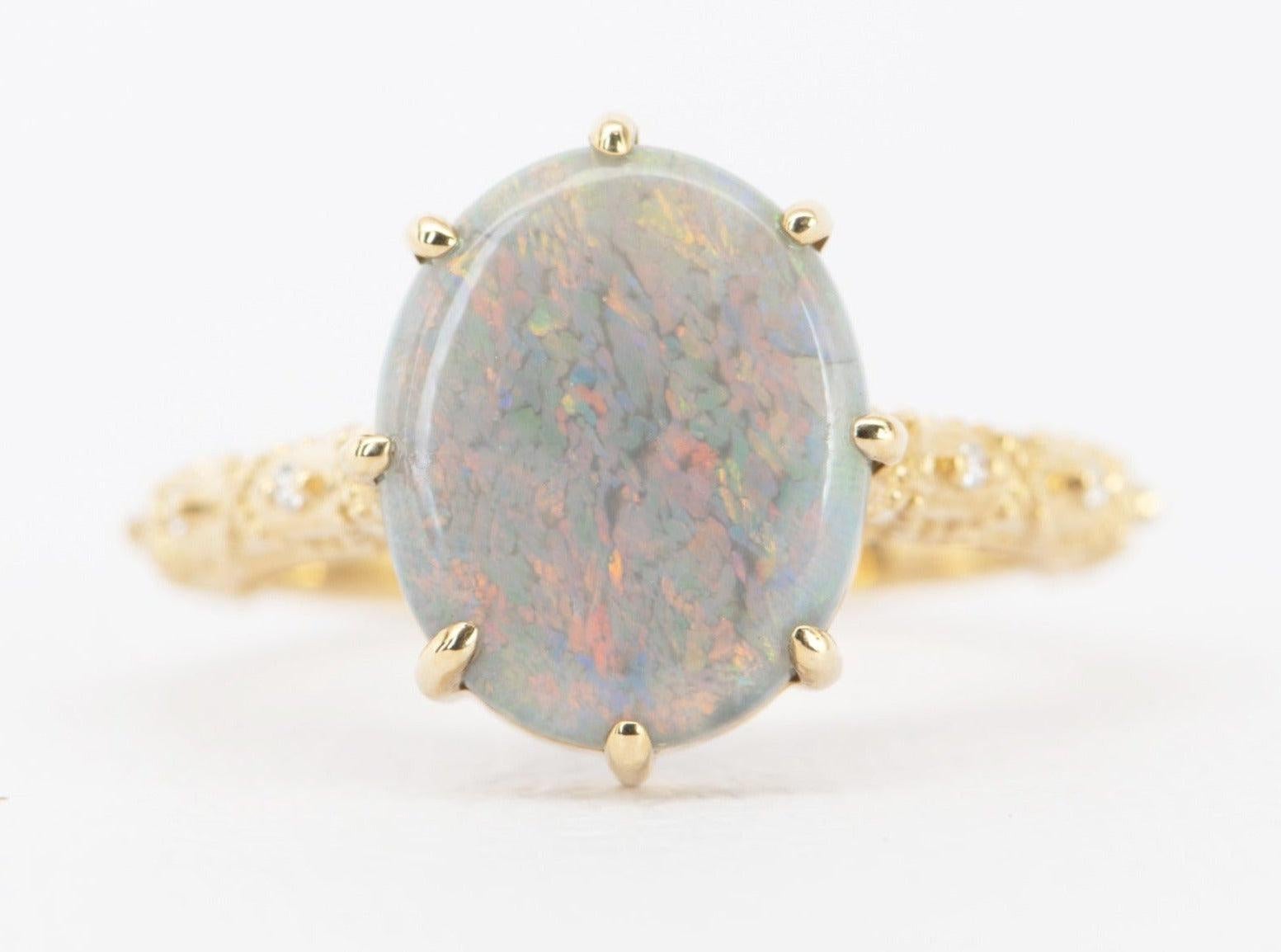 This bright and colorful Australian Opal gemstone is paired with a vintage-inspired lace band, creating a beautiful contrast and adding an elegant touch to the piece.


♥ The overall setting measures 13.6 mm in width, 11.5 mm in length, and sits 6.7