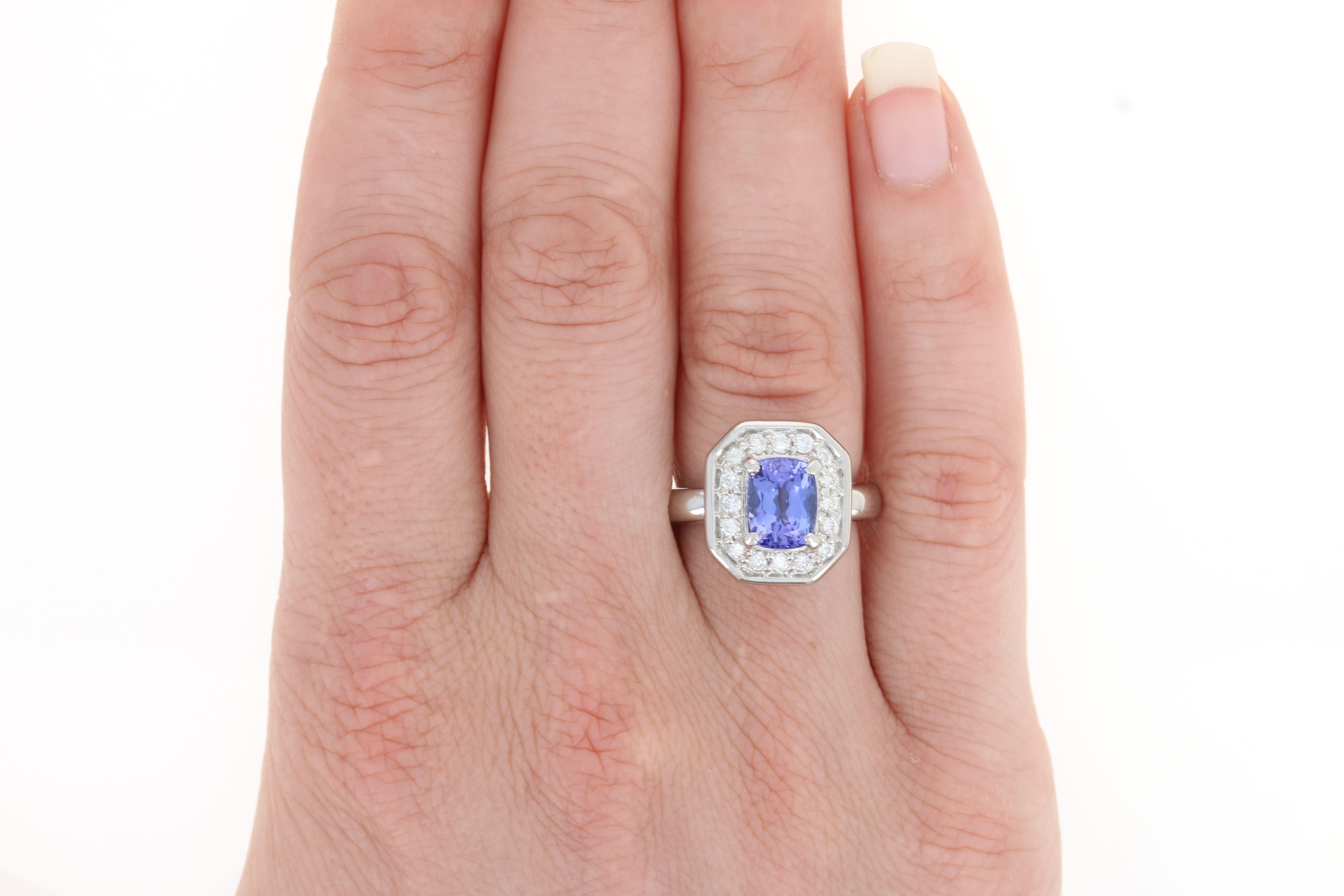 Give your December birthday girl the gift of sparkling gems! Held in an exquisite 850 platinum mount, this ring hosts a silky purple tanzanite framed by a luminous diamond halo. 

This ring is a size 5 3/4 - 6.

Metal Content: Guaranteed 850