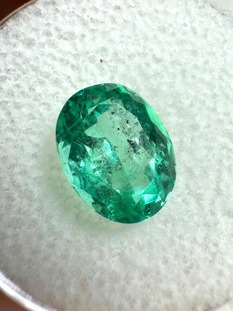 Stone: Emerald
Weight: 2.83-carats
Shape: Oval Cut
Clarity: Transparent
Luster: Excellent-Very Good
Color: Medium Light Green
Measurements: 9.98mm x 7.75mm x 5.79mm
Geographic Origin: Colombia
Treatment: Natural, Oiling

Comments: Due to their
