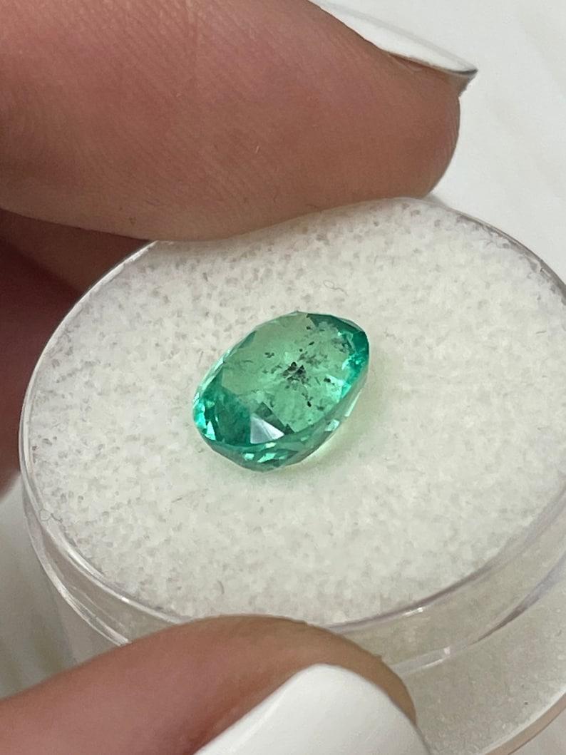 2.83 Carat 10x8mm Vibrant Freckled Green Colombian Emerald Oval Cut - May Births For Sale 2