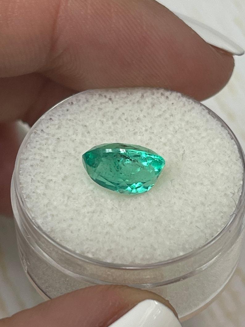 2.83 Carat 10x8mm Vibrant Freckled Green Colombian Emerald Oval Cut - May Births For Sale 3