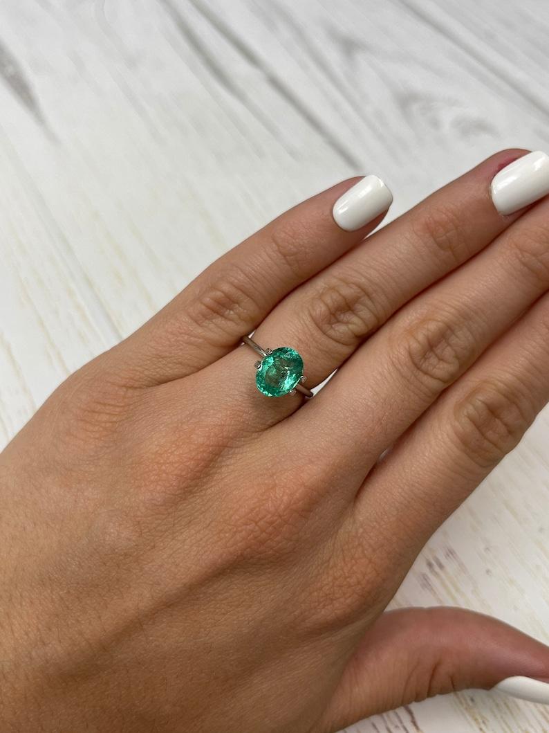 2.83 Carat 10x8mm Vibrant Freckled Green Colombian Emerald Oval Cut - May Births For Sale 4