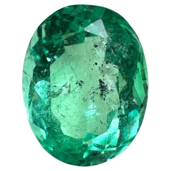 2.83 Carat 10x8mm Vibrant Freckled Green Colombian Emerald Oval Cut - May Births For Sale