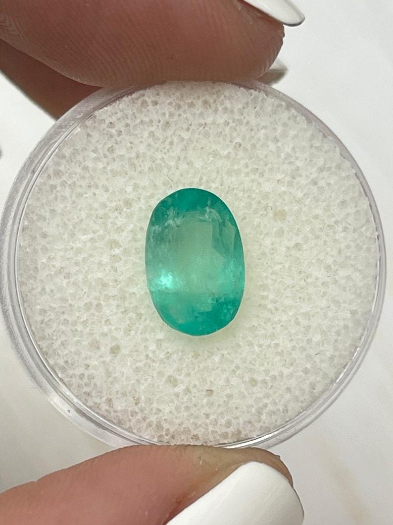 2.83 Carat 11x7mm Pastel Mint Green Colombian Emerald Oval Cut - May Birthstone For Sale 2