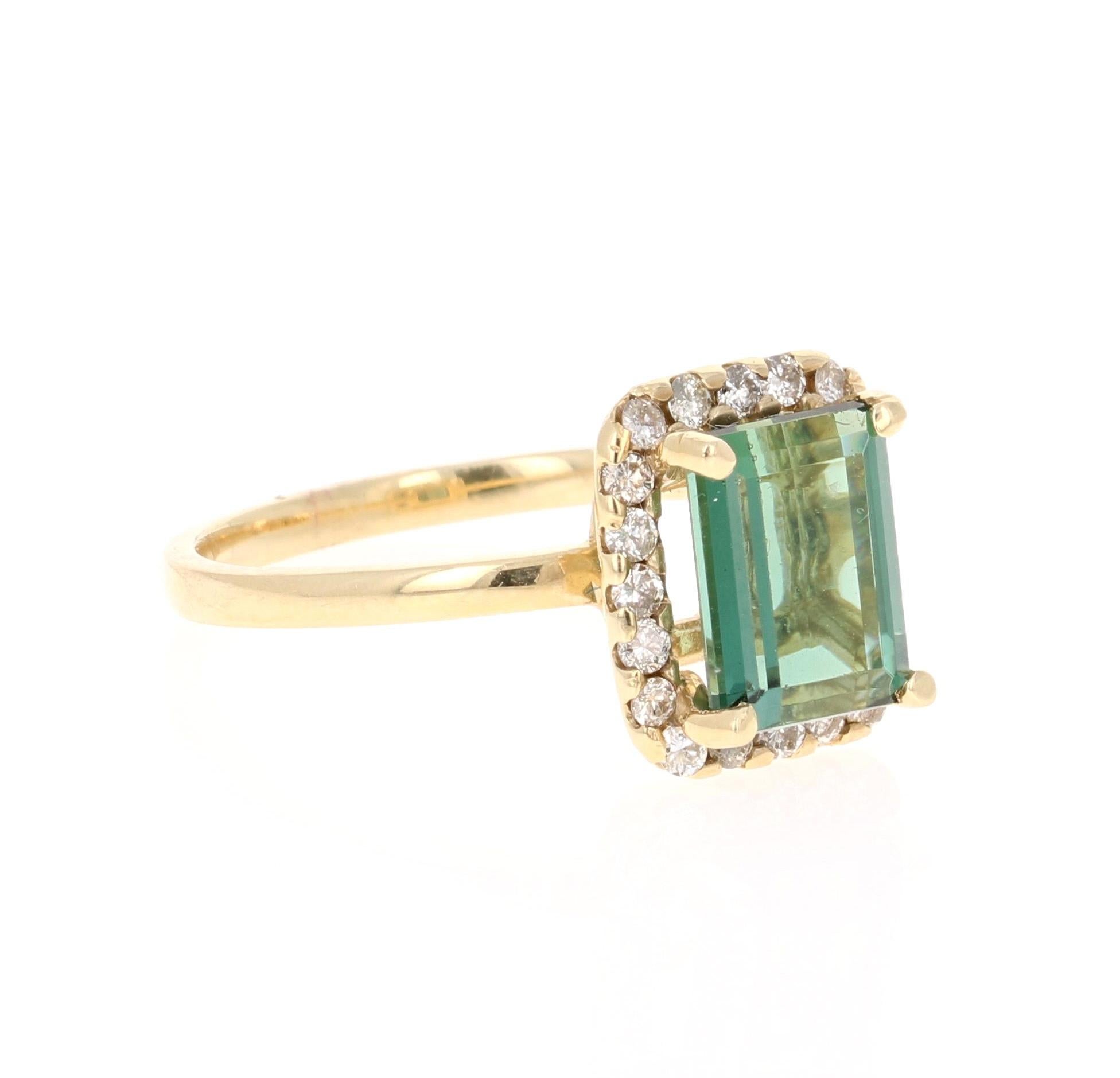 A beauty that is different and one of a kind. Can be a beautiful Engagement, Wedding, or Anniversary Ring. 

This ring has a magnificently beautiful Emerald Cut Green Tourmaline that weighs 2.52 Carats and has 20 Round Cut Diamonds weighing 0.31