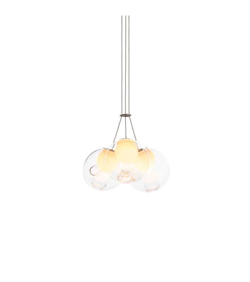 28.3 Cluster pendant lamp by Bocci
Dimensions: diameter 33 x height 300 cm 
Materials: blown glass, braided metal coaxial cable, electrical components, brushed nickel canopy.
Lamping: : 1.5w LED or 20w xenon. Non-dimmable. 
Coax: adjustable.