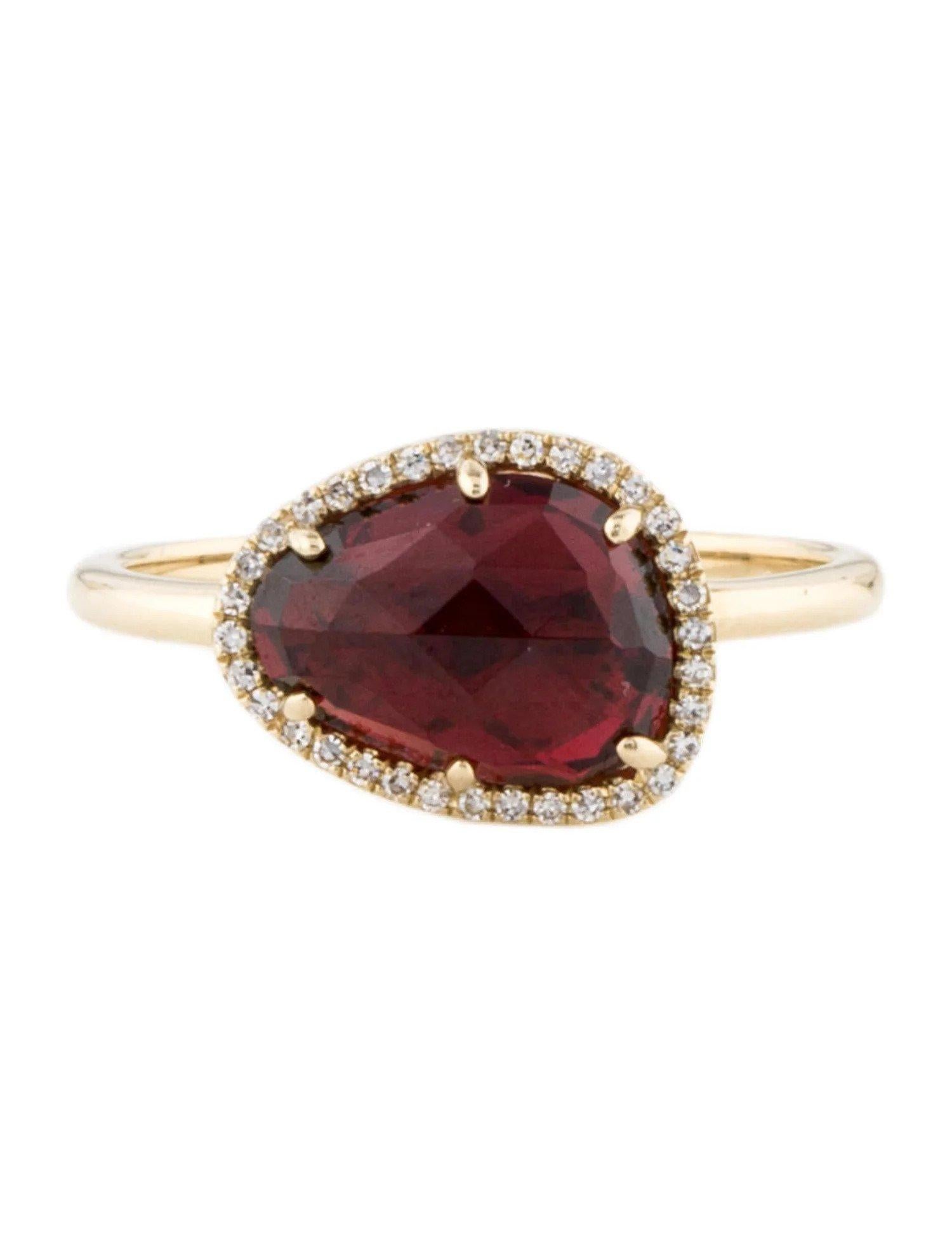 This Garnet & Diamond Ring is a stunning and timeless accessory that can add a touch of glamour and sophistication to any outfit. 

This ring features a 2.84 Carat Mixed Cut Garnet (12 x 9 MM), with a Diamond Halo comprised of 0.08 Carats of Single