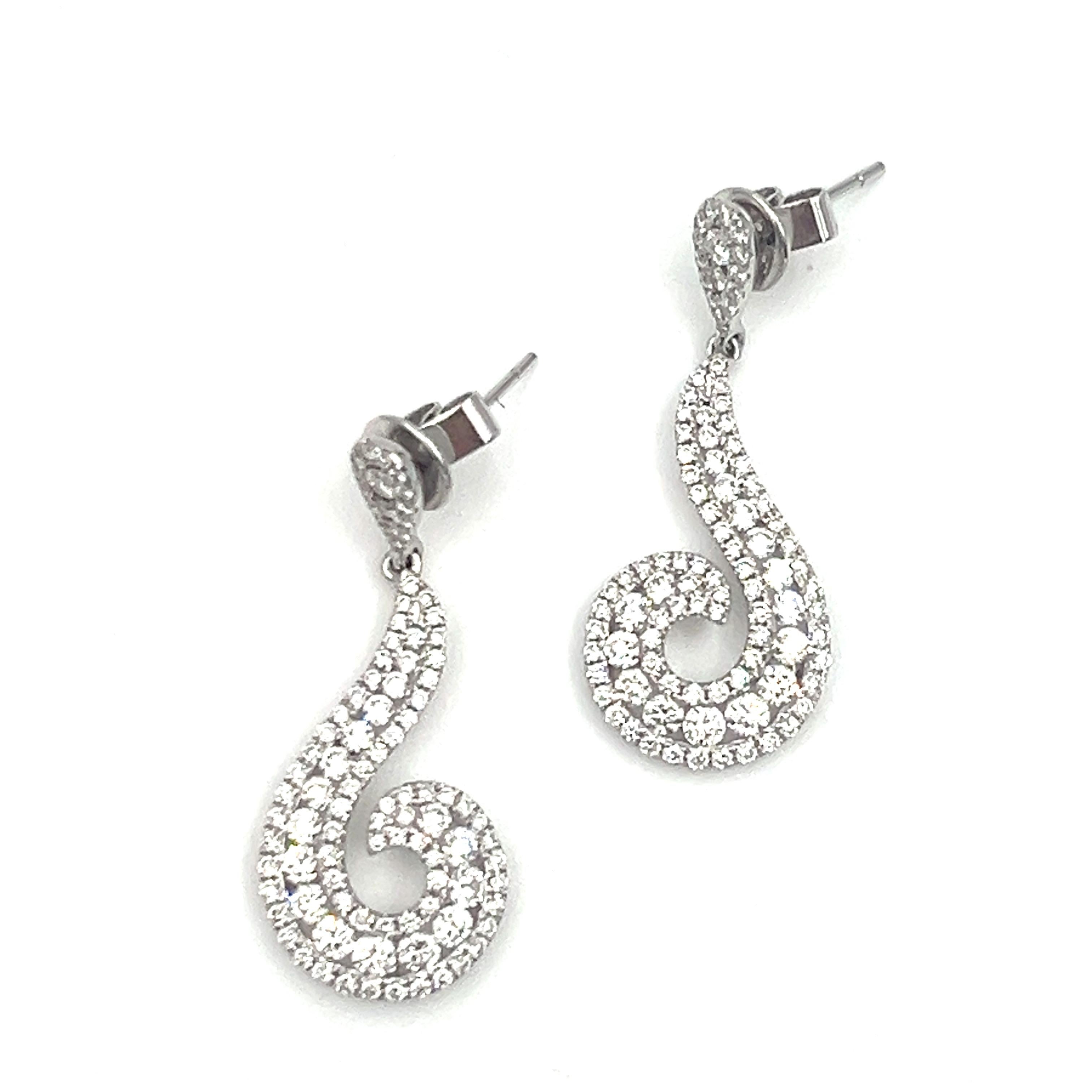 These stunning 2.84 ct diamond dangle earrings will be a showstopper to your wardrobe. Featuring 194 diamonds with an F/G in color and a VS1/VS2 in clarity, they are a must have for any fashionista. 