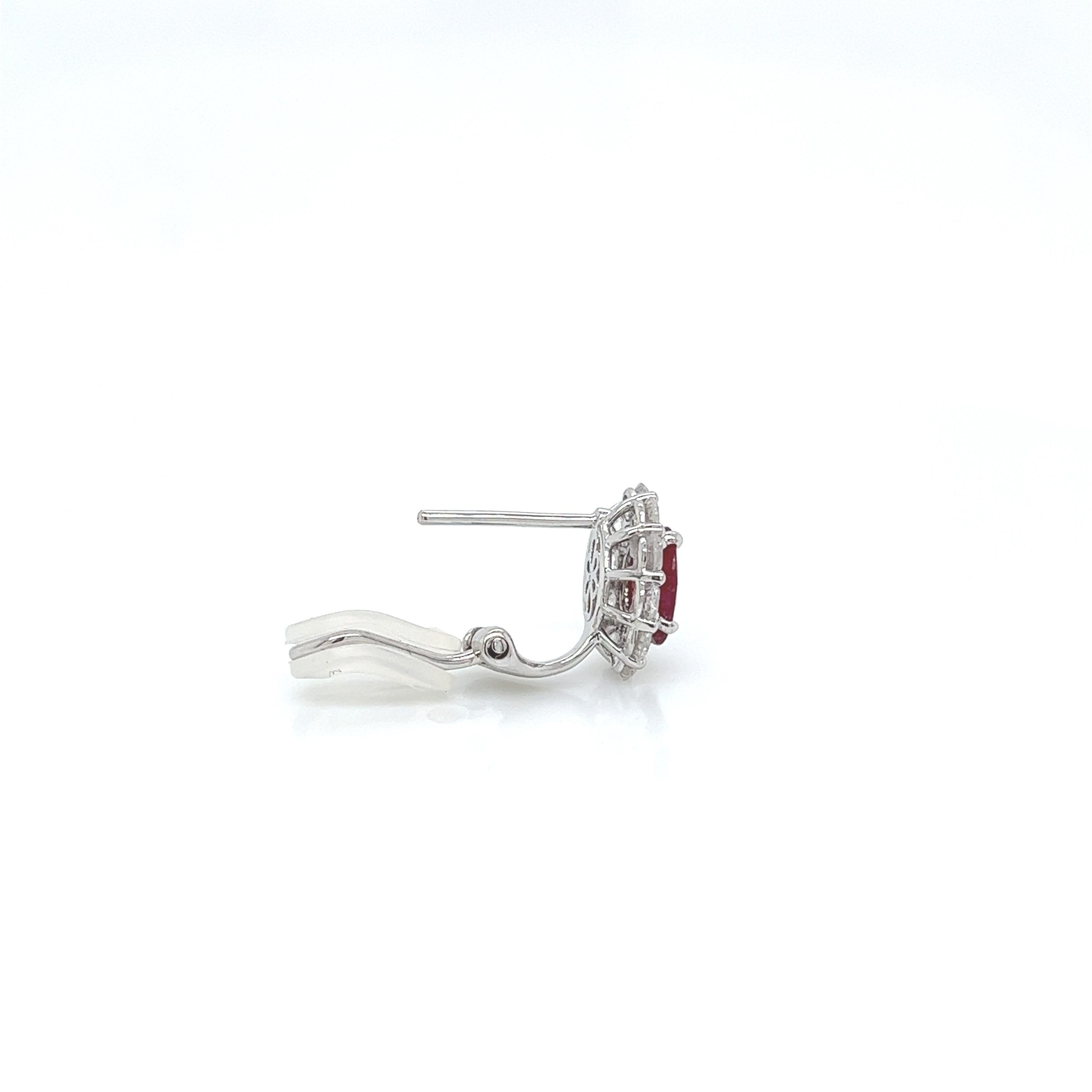 2.84 Total Carat Ruby and Diamond Earrings in 18K White Gold

This gorgeous pair of Ruby earrings are sure to draw all eyes on you. It is created with a single 1.54 Carat Oval Ruby, surrounded by a halo of round cut diamonds totaling a generous 1.30