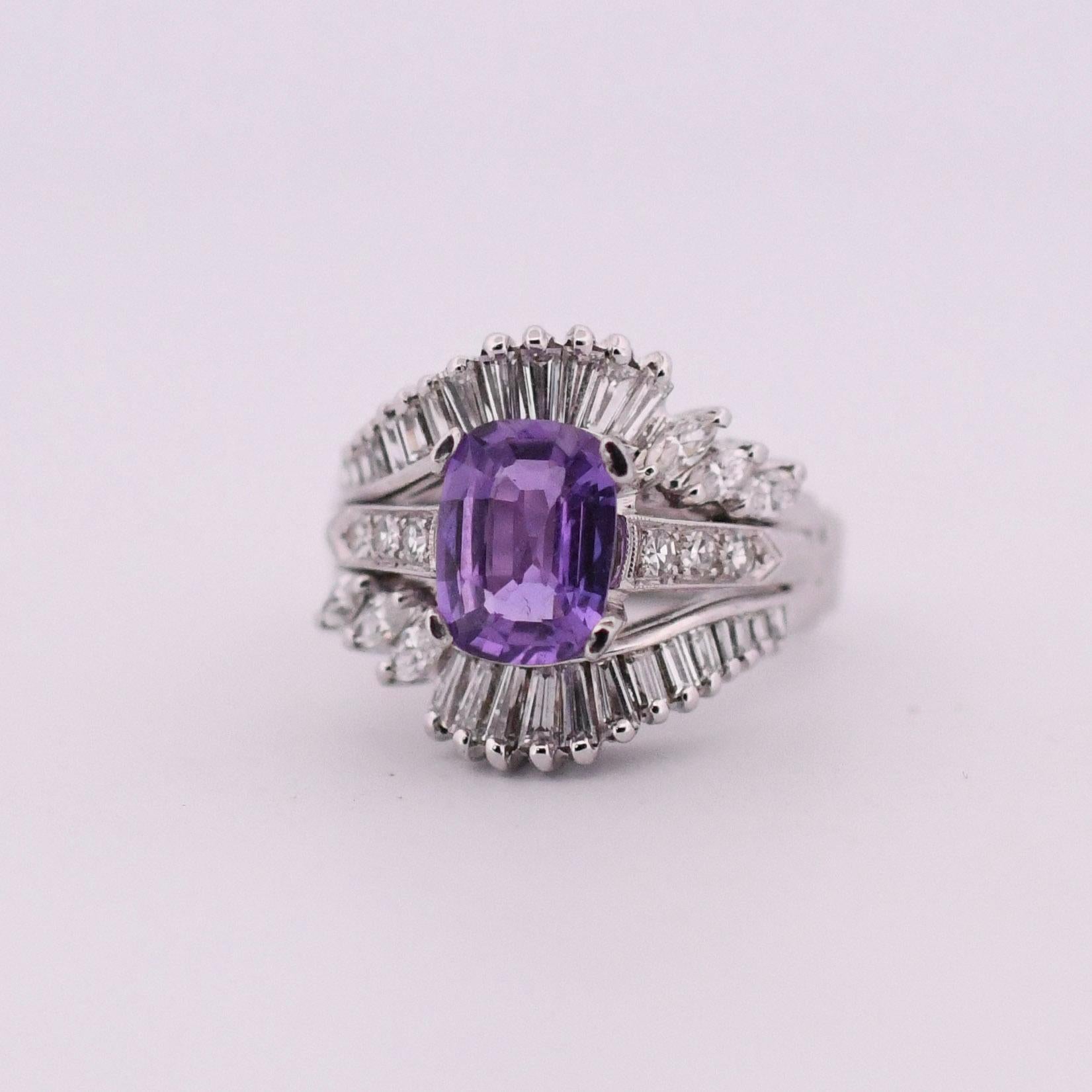 Prepare to be enchanted by the rare and remarkable beauty of this magnificent cocktail ring. At its center lies a breathtaking 2.53-carat Madagascar Purple Sapphire, untouched by heat treatment, making it an exceptionally rare gemstone in its
