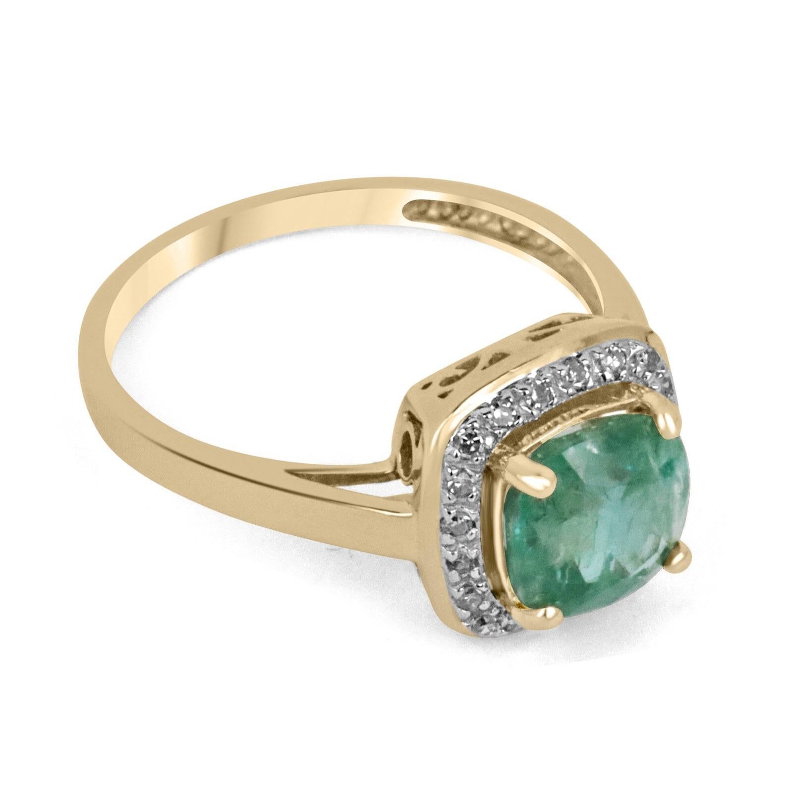 A stunning emerald and diamond right-hand/engagement ring. The center stone features a gorgeous 2.66-carat, natural earth-mined cushion cut emerald from the origin of Zambia. This gemstone displays a warm bluish-green color, with good clarity and