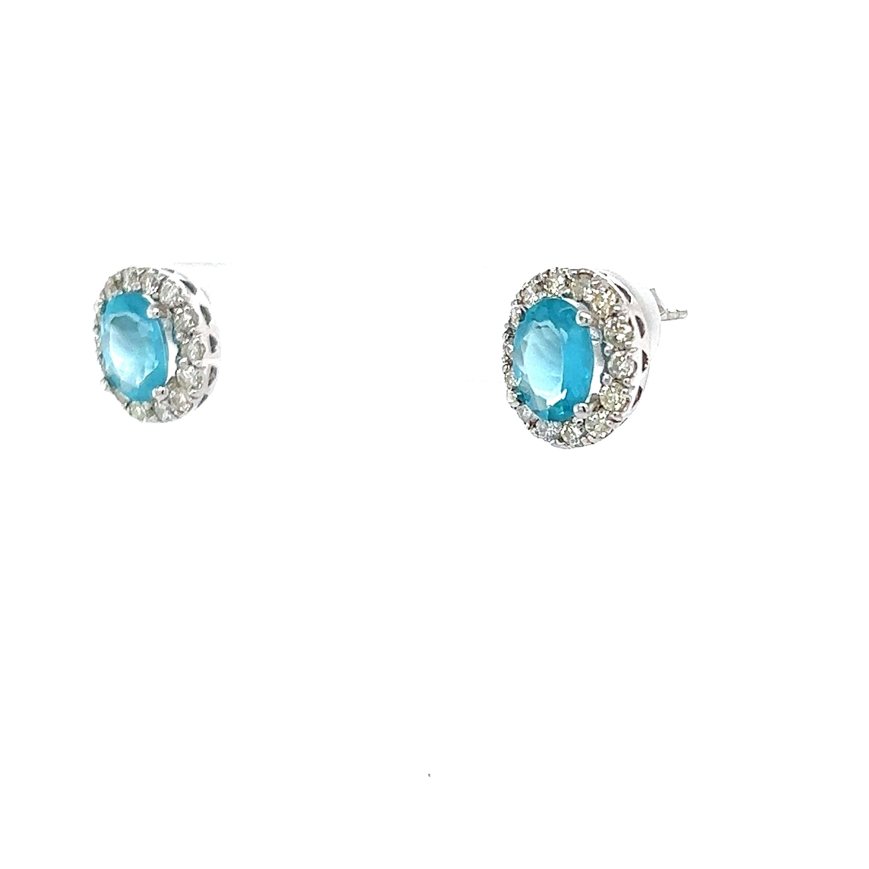Apatite and Diamond Earrings
2 Natural Oval Cut Apatites that weigh 2.12 Carats and measures at 8 mm x 6 mm. The earrings measure at 12 mm x 10 mm. 

There are 28 Round Cut Natural Diamonds that weigh 0.73 carats and have a clarity/color of
