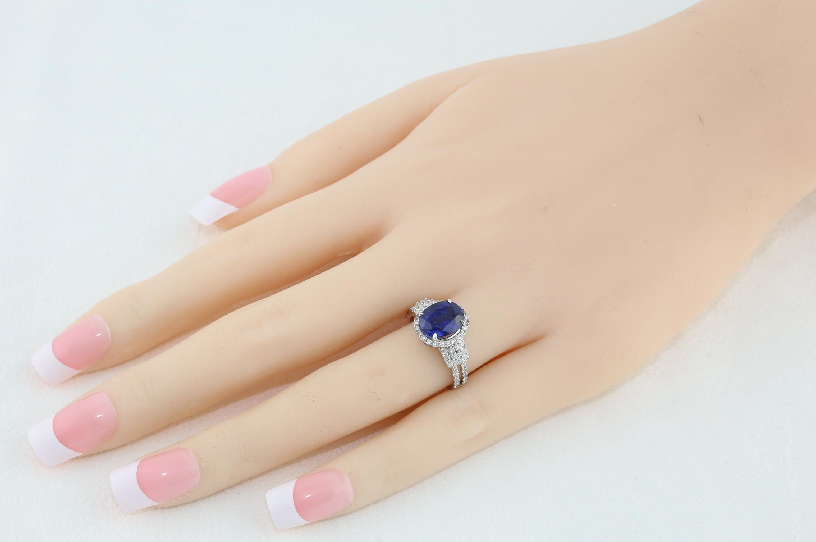 Contemporary 2.85 Carat Blue Sapphire Diamond Gold Halo Ring