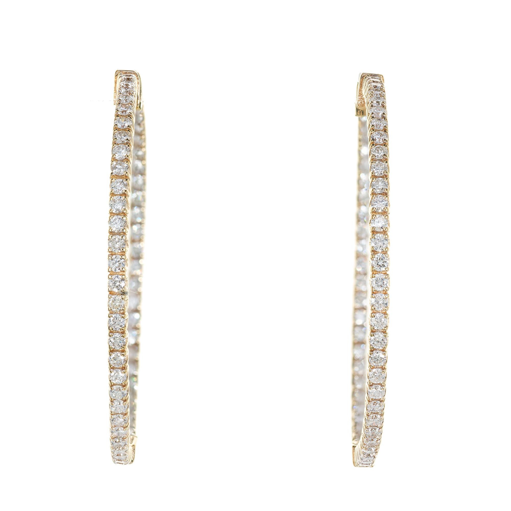2 Inch wide diamond hoop earrings. 114 round brilliant cut diamonds 2.85cts set in 14k yellow gold hoop settings. 

114 round brilliant cut diamonds, G-H VS SI approx. 2.85cts
14k yellow gold 
9.7 grams
Top to bottom: 41.7mm or 1.64 Inches
Width: