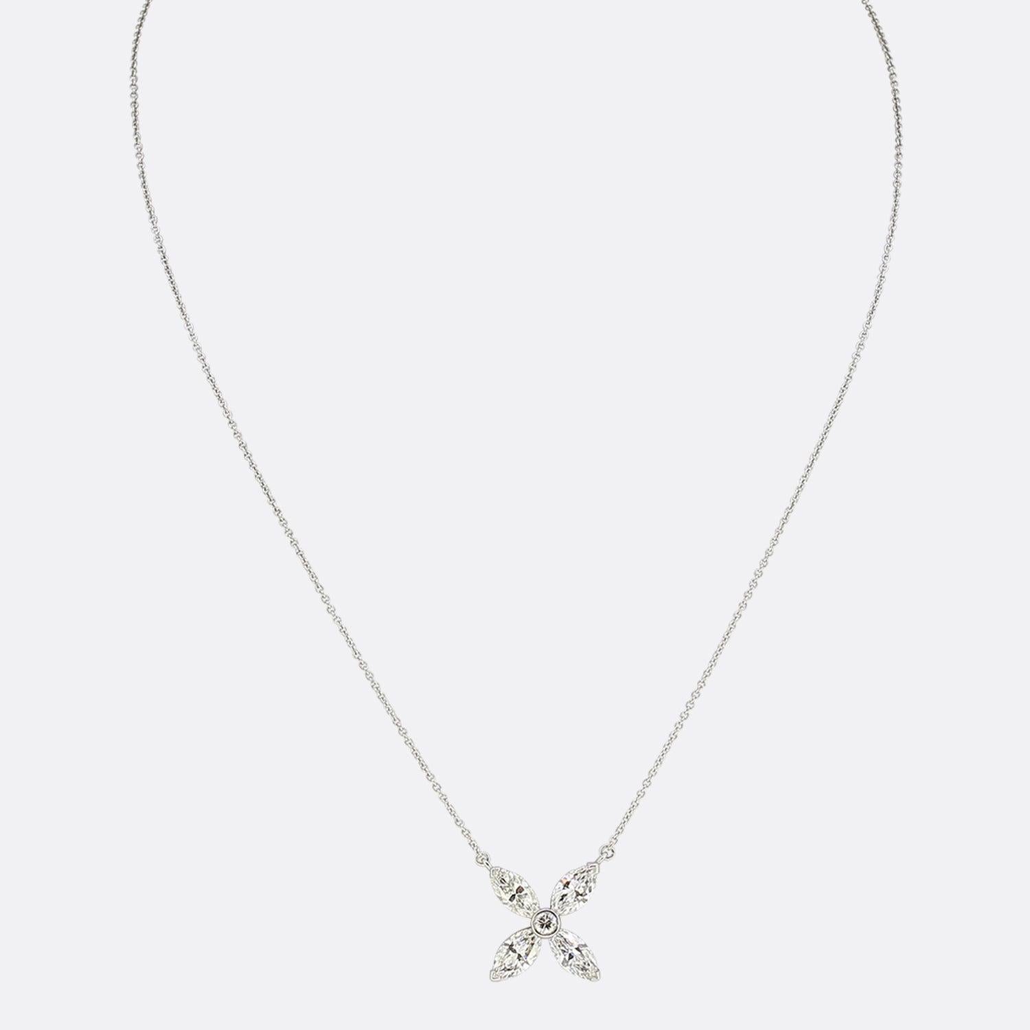This is an 18ct white gold necklace featuring a stunning 2.85 carat diamond pendant. The pendant is formed of 4 marquise cut diamonds set around a brilliant cut diamond centre. The diamonds are perfectly matched for colour and clarity and an