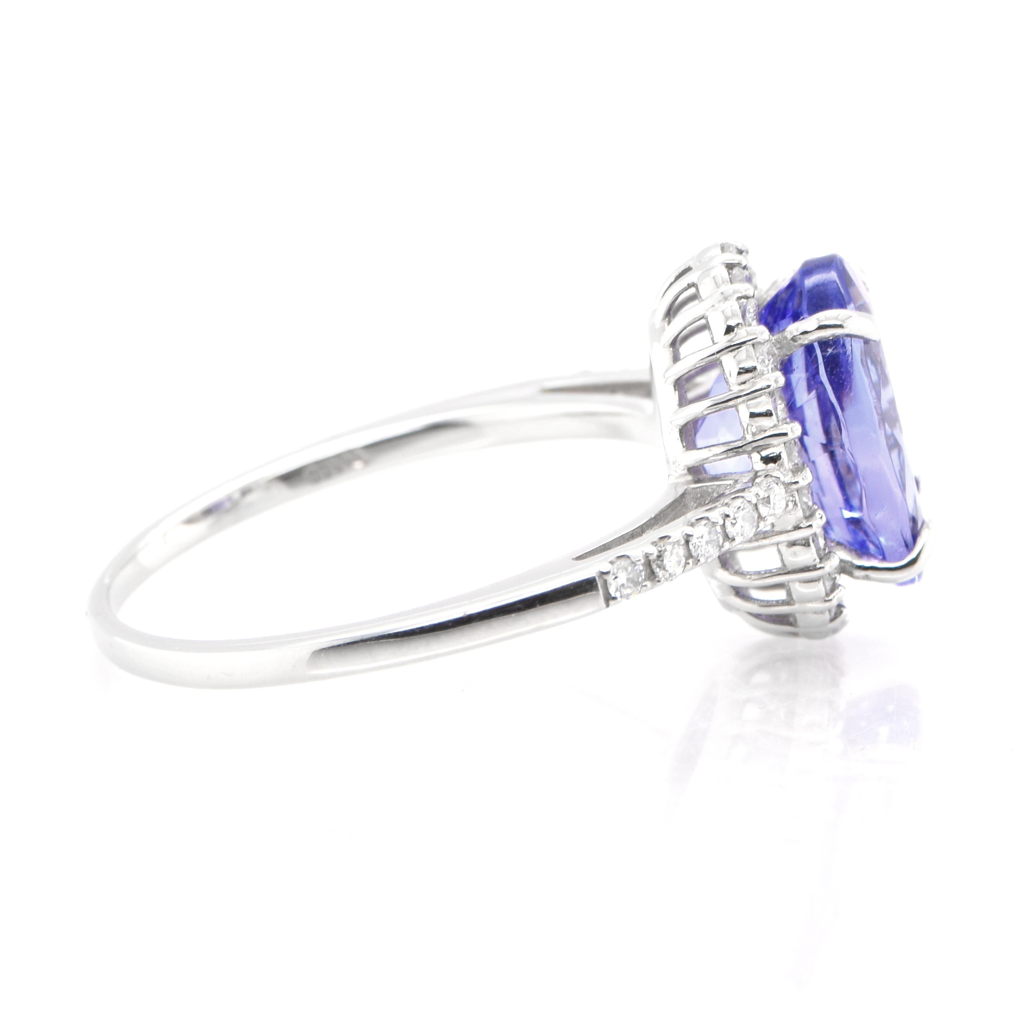 Modern 2.85 Carat Natural Tanzanite and Diamond Halo Ring Set in Platinum For Sale