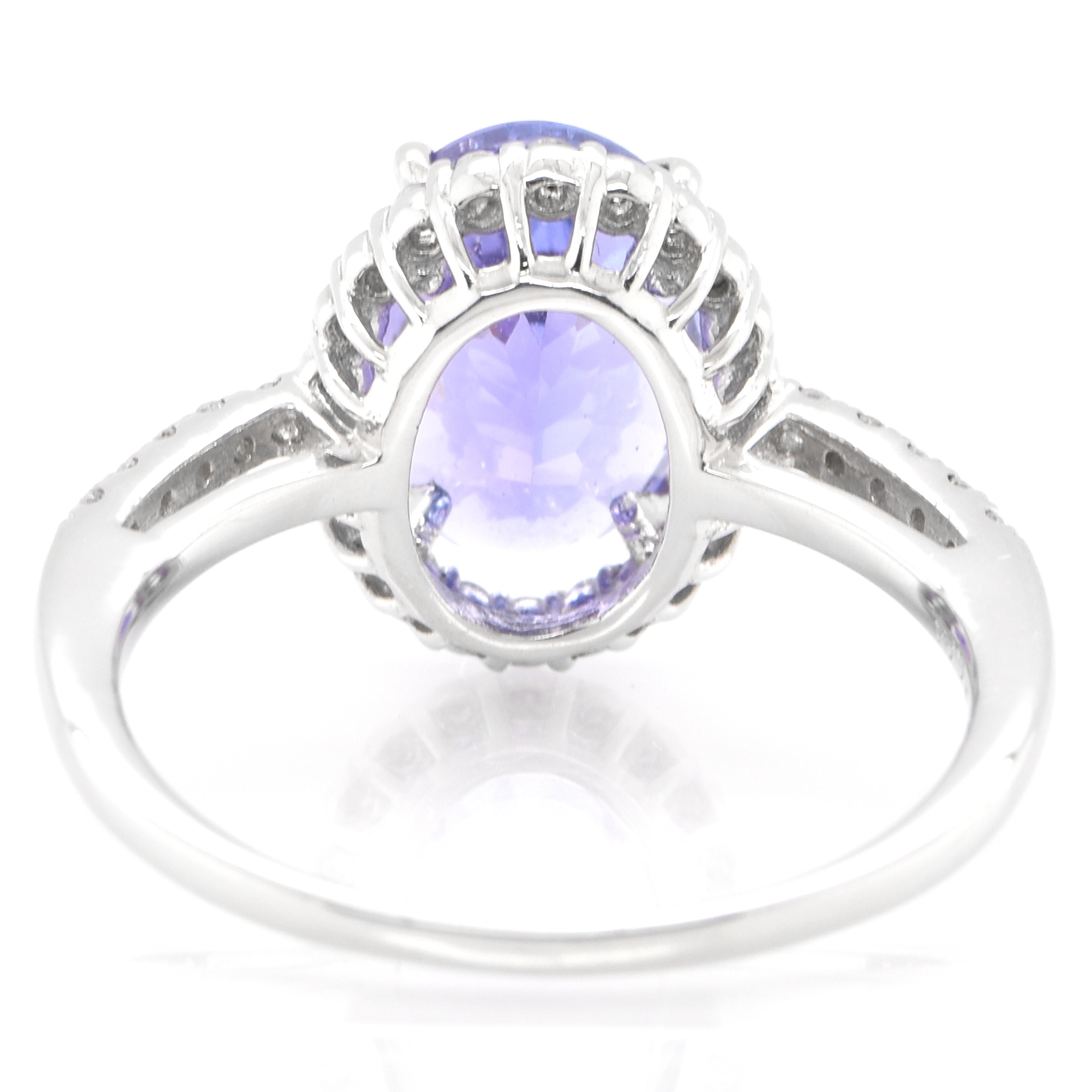 Oval Cut 2.85 Carat Natural Tanzanite and Diamond Halo Ring Set in Platinum For Sale