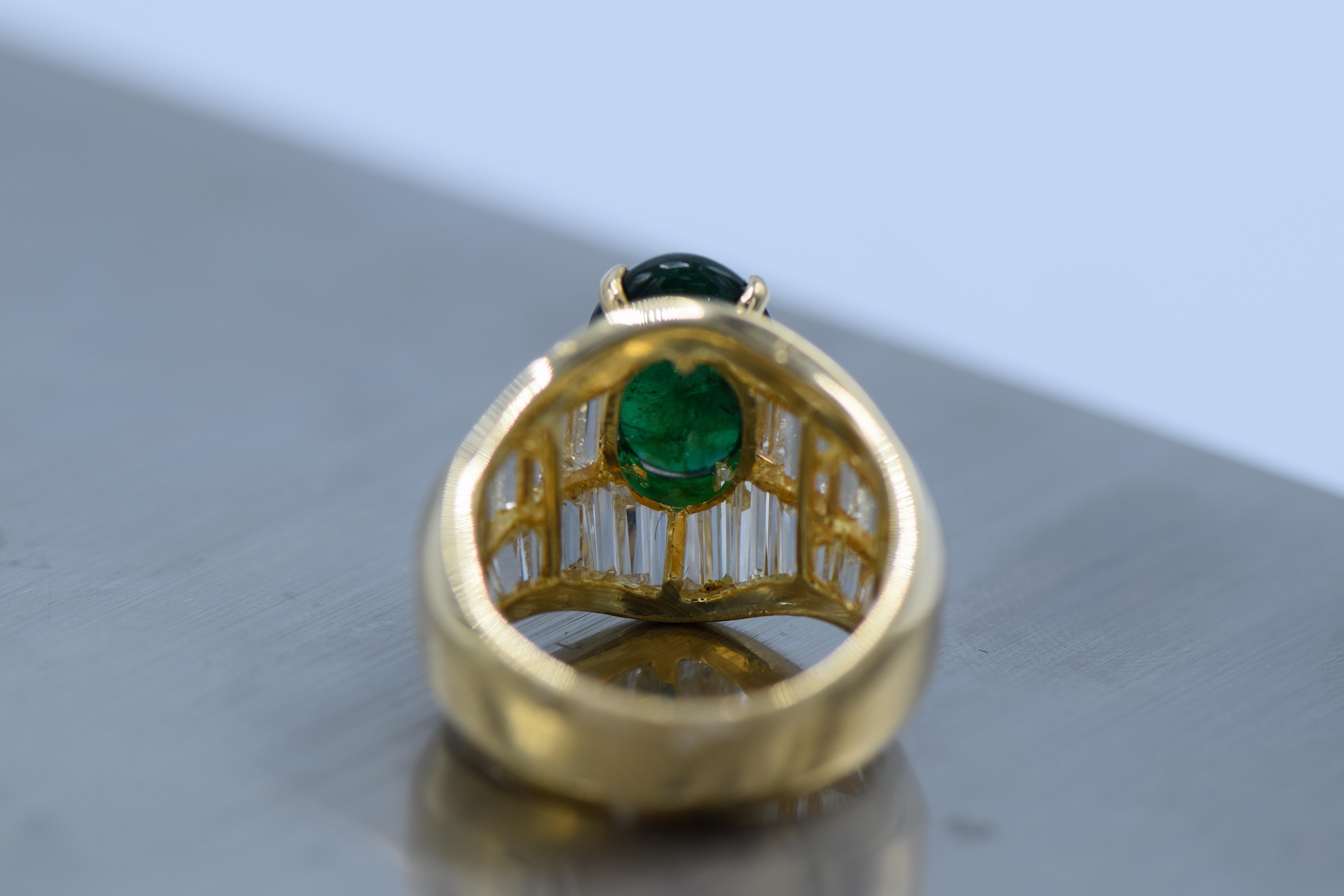 18 kt., one oval cabochon emerald ap. 2.85 cts.

40 baguette & tapered baguette diamonds ap. 2.45 cts., ap. 6.8 dwts.

Size 5 3/4. 

Cabochon emerald: deep green, good color saturation, moderately included, translucent, good polish. 

Color: