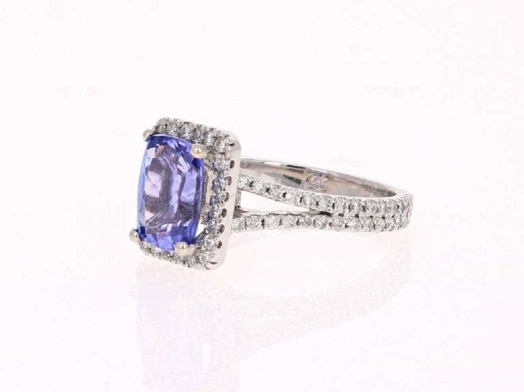 This Gorgeous Ring has a 2.06 Carat Tanzanite that is set in the center of the ring.  The Tanzanite is surrounded by a Halo of 93 Round Cut Diamonds that weigh 0.79 carats. The total carat weight of the ring is 2.85 carats.   

The ring is made in