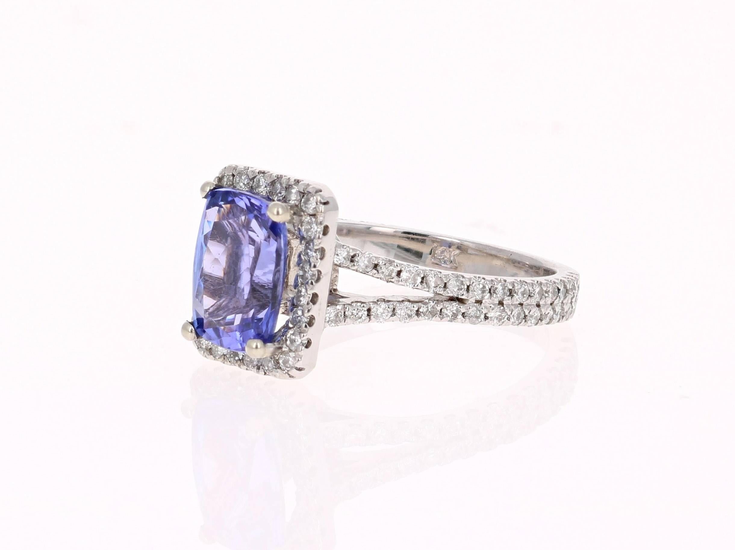 This Gorgeous Ring has a 2.06 Carat Tanzanite that is set in the center of the ring.  The Tanzanite is surrounded by a Halo of 93 Round Cut Diamonds that weigh 0.79 carats. The total carat weight of the ring is 2.85 carats.   

The ring is made in