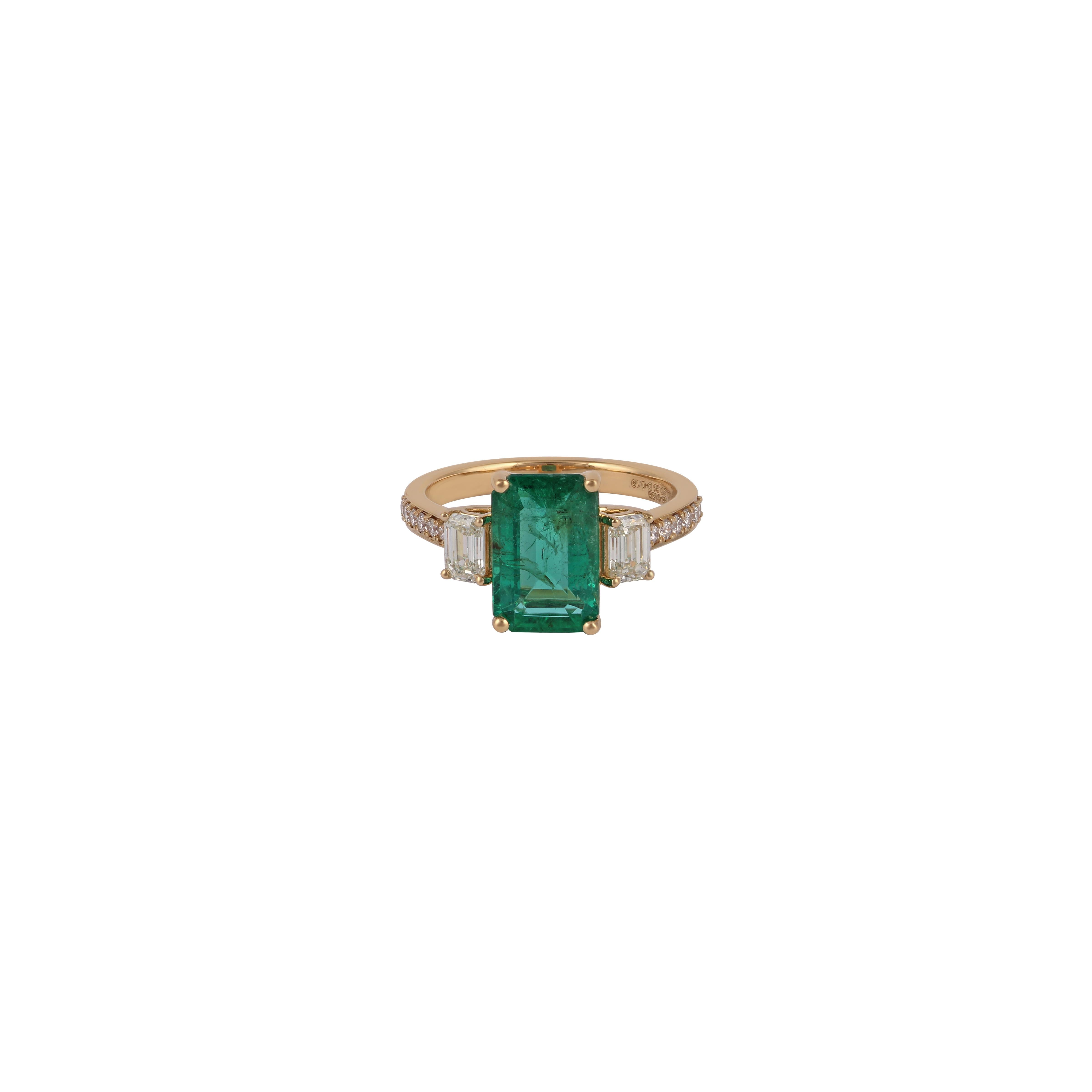 Its an exclusive emerald & diamond ring studded in 18k yellow gold with 1 piece of octagon shaped emerald weight 2.85 carat with 2 pieces of emerald cut diamonds weight 0.65 carat & 14 pieces of round shaped diamonds weight 0.19 carat this entire