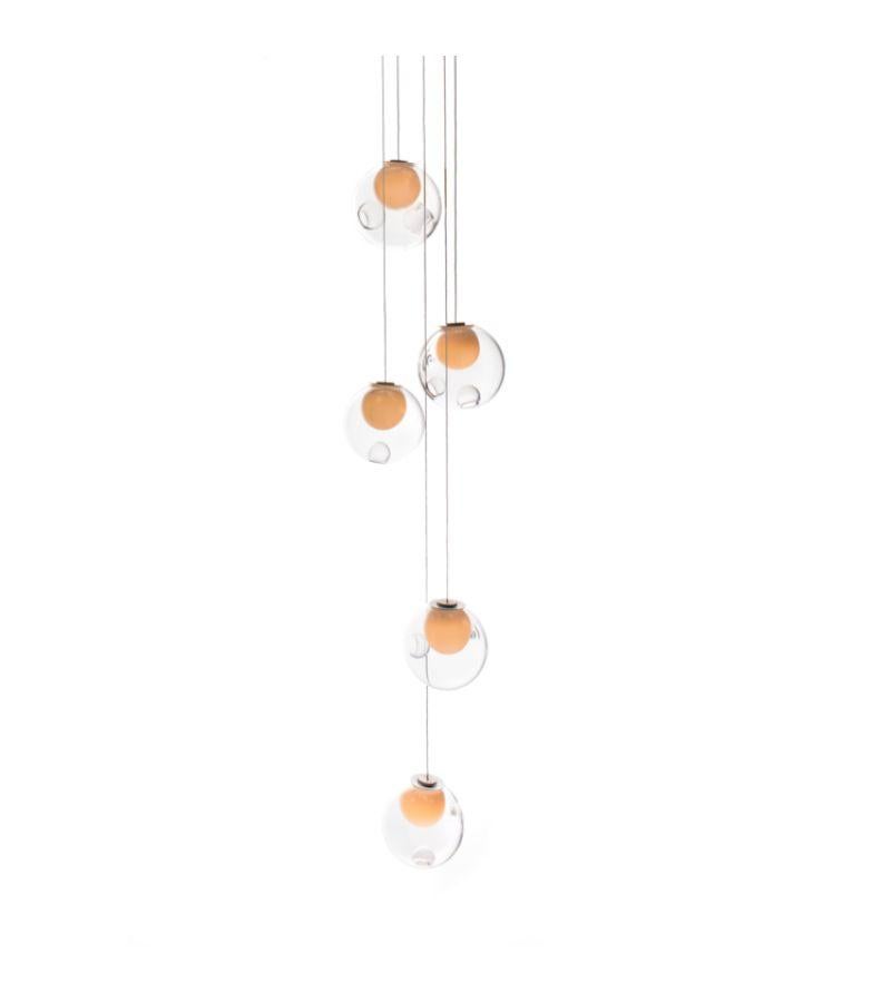 28.5 pendant lamp by Bocci
Dimensions: Diameter 20.3 x Height 300 cm 
Materials: blown glass, braided metal coaxial cable, electrical components, brushed nickel canopy.
Lamping: : 1.5w LED or 20w xenon. Non-dimmable. 
Coax: adjustable. 3000mm