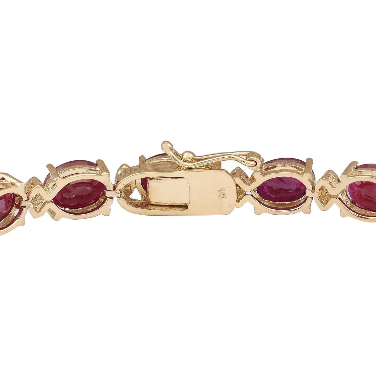 Adorn your wrist with sheer opulence with our 14 Karat Yellow Gold Diamond Bracelet, featuring a dazzling 28.58 Carat Ruby centerpiece, delicately set alongside sparkling diamonds totaling 0.80 Carat. Crafted to perfection and stamped with 14K, this