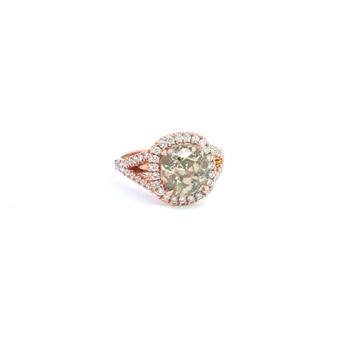 Introducing our enchanting 2.85ct Green Diamond 18k Rose Gold Ring, a testament to refined elegance and timeless allure. The central piece features a breathtaking 2.85ct green diamond, skillfully cut into the vintage-inspired Old European Cushion