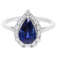 Anello di fidanzamento in oro bianco 14k con zaffiro blu taglio pera e diamante aureolato SI/H da 2,85 carati