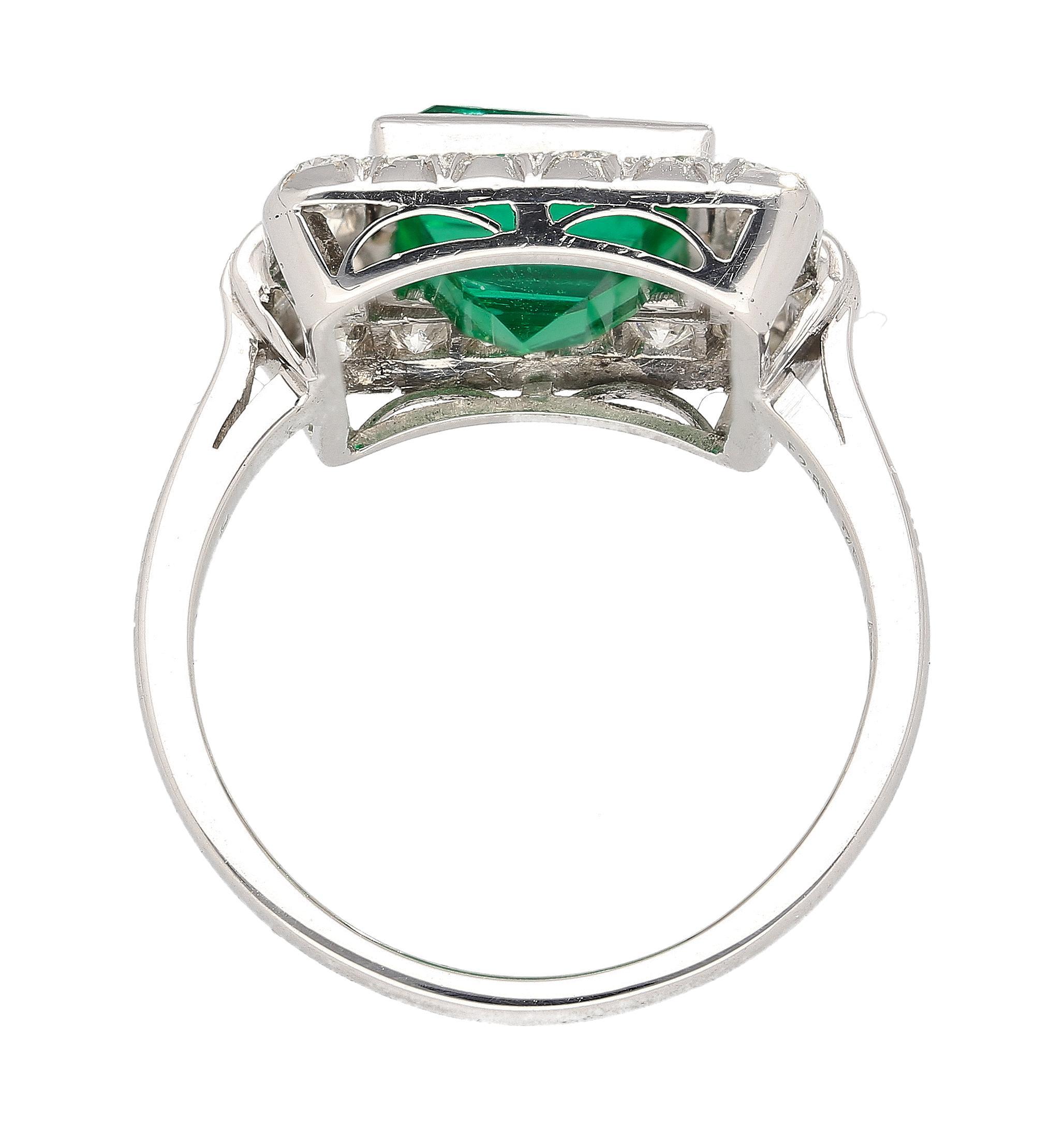AGL Certified 2.86 Carat Minor Oil Afghan/China Border Origin Emerald and Diamond Halo in 18k White Gold Bezel Set Ring.

Crafted in 18K white gold, natural green 2.86-carat weight emerald, with a rectangular-step cut. Emerald origin comes from the