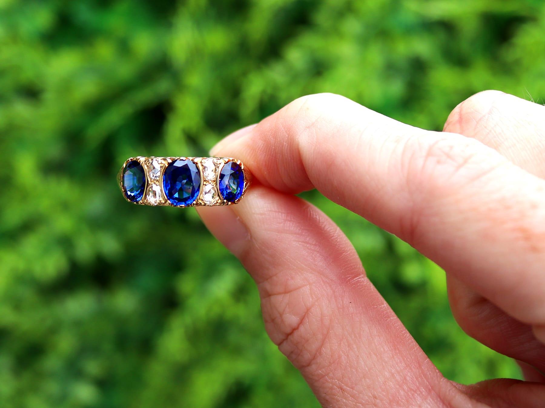 A stunning, fine and impressive vintage 2.86 carat Basaltic sapphire and 0.28 carat diamond, 18 karat yellow gold three stone ring; part of our diverse sapphire jewelry collections.

This stunning, fine and impressive vintage sapphire and diamond