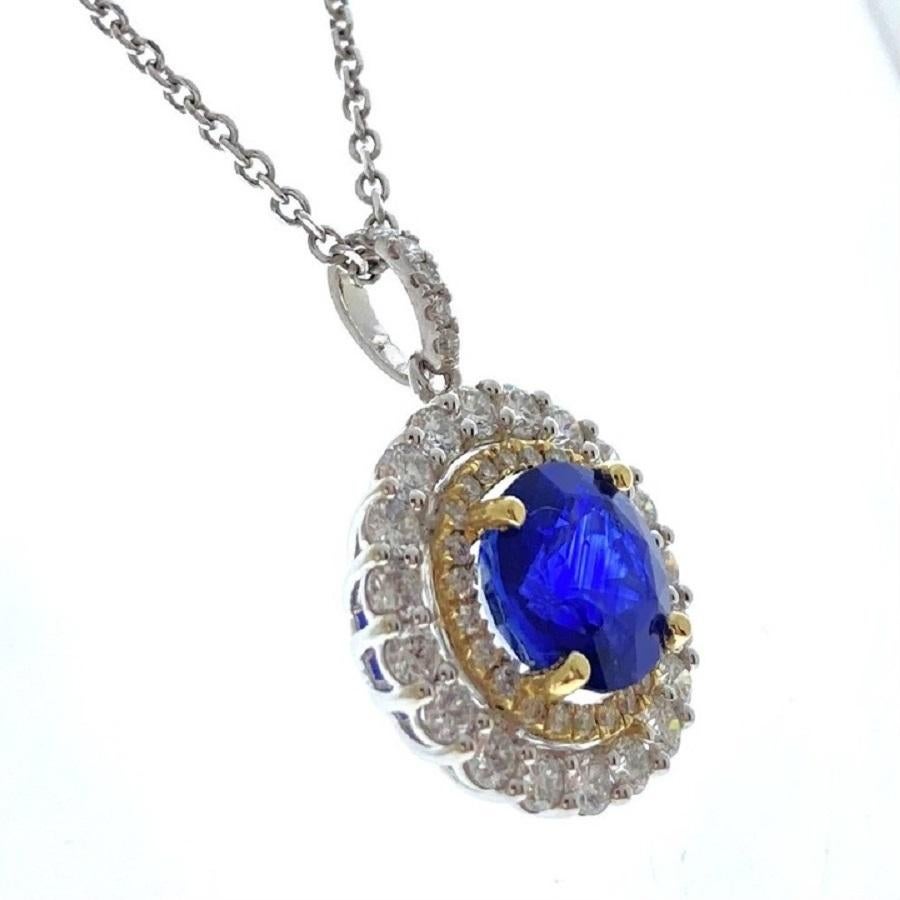 This dazzling pendant showcases a mesmerizing 2.86-carat blue round sapphire, renowned for its vivid, captivating hue and sparkling brilliance. The sapphire is elegantly set in a 14k white gold setting, which enhances its vibrant color with a