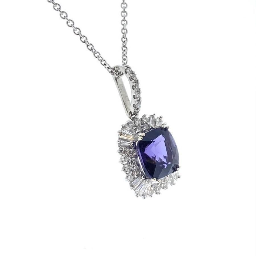 This pendant is a captivating expression of elegance and allure. Crafted in 18 karat white gold, it features a stunning 2.86 carat cushion-shaped purple spinel as its centerpiece. The rich, regal hue of the spinel adds a touch of luxury and