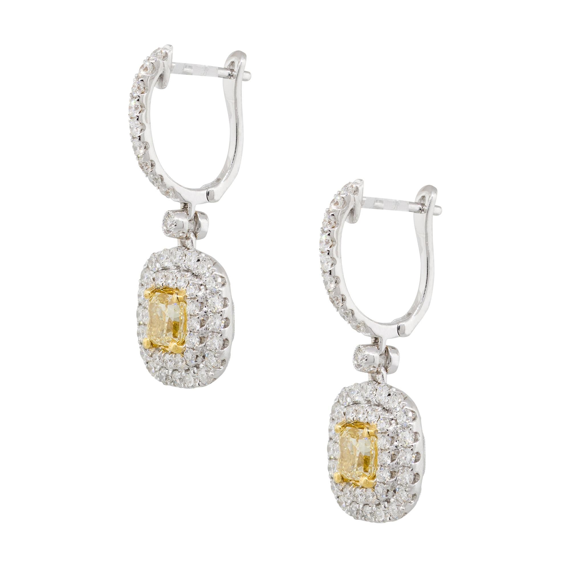 Material: 18k Yellow and White gold
Style: Double Halo Drop Earrings
Diamond Details: Approx. 1.30ctw cushion cut Diamonds. Diamonds are Fancy Yellow in color and VS in clarity
                             Approx. 1.56ctw of round cut Diamonds.