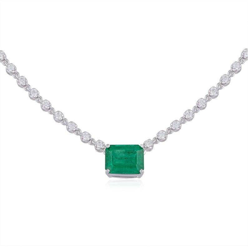 Cast from 14 karat white gold, this stunning necklace is hand set with 2.86 carats Emerald and 2.10 carats of sparkling diamonds. 

FOLLOW MEGHNA JEWELS storefront to view the latest collection & exclusive pieces. Meghna Jewels is proudly rated as a