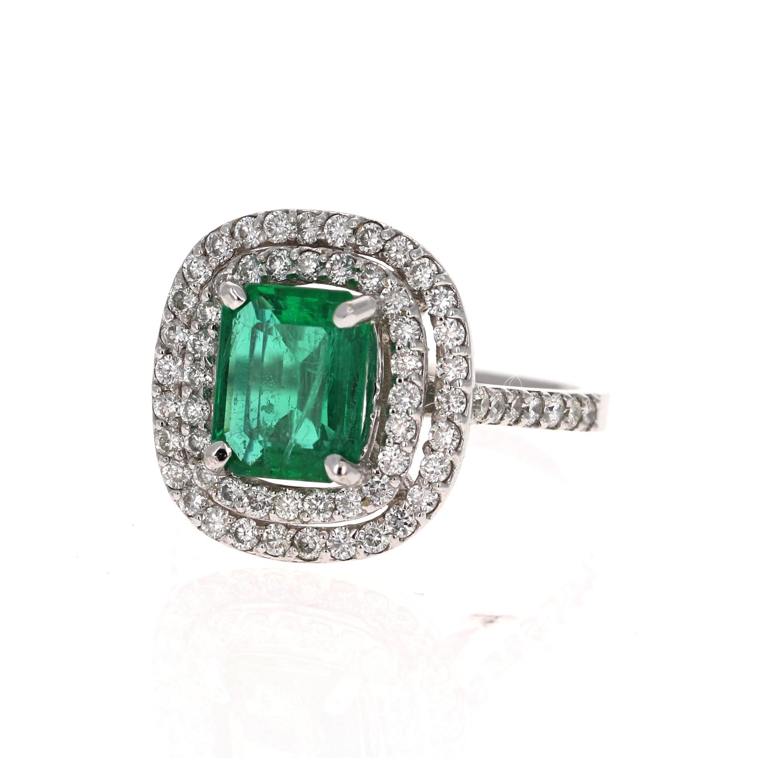 Exquisite Emerald Cut Emerald Diamond Ring! 

This Emerald ring is absolutely gorgeous. The center is an Emerald Cut Emerald which weighs 1.96 Carats and measures in at 9mm x 7mm.  The Emerald is surrounded by 68 Round Cut Diamonds weighing 0.90