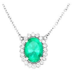 2.86 Carat Oval Cut Emerald and 0.43 Carat White Diamond Pendant