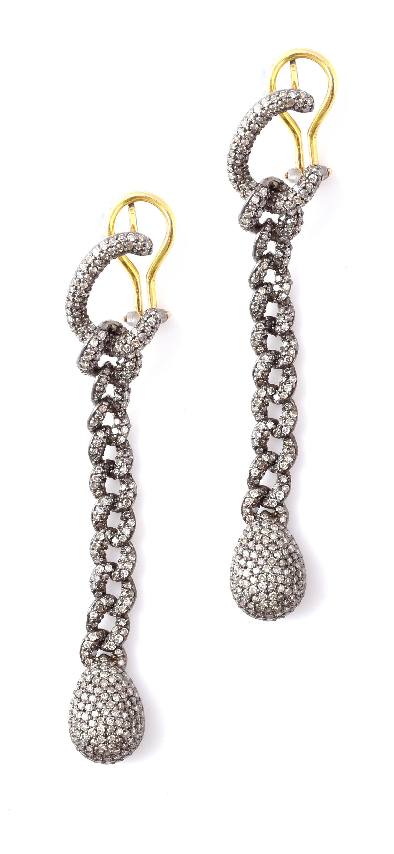 2.86 Carat Pave Diamond Link-Chain Drop Earrings

This Victorian art-deco style diamond pave set link earring is mesmerizing. The bottom drop is exceptionally formed with several graduating pave set diamonds rows beautifying the overall look, as it