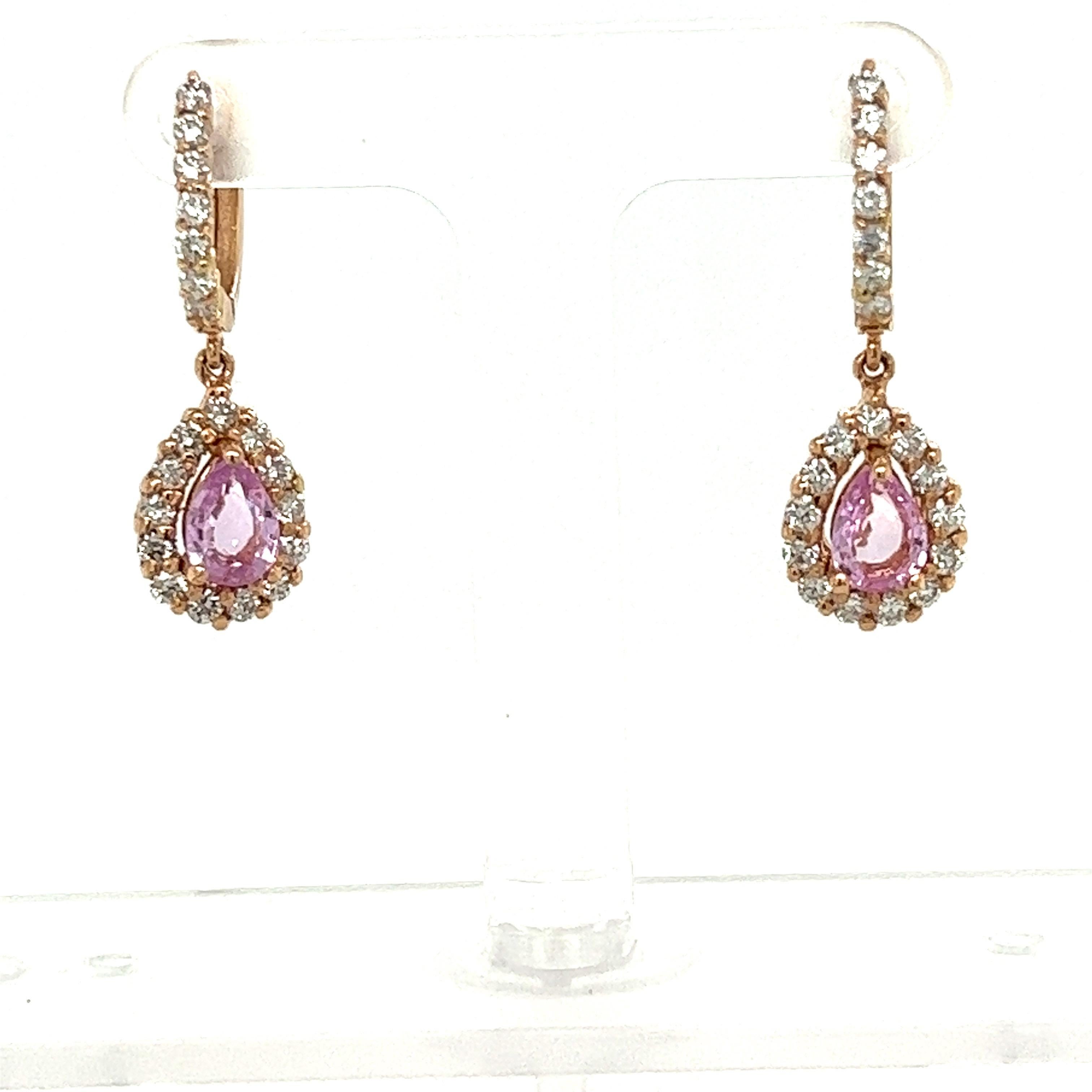 These earrings have Pear Cut Pink Sapphires that weigh 1.68 carats and measure at approximately 7 mm x 5 mm. There are Natural Round Cut Diamonds that weigh 1.18 carats. The total carat weight of the earrings are 2.86 carats. 

Curated in 18 Karat