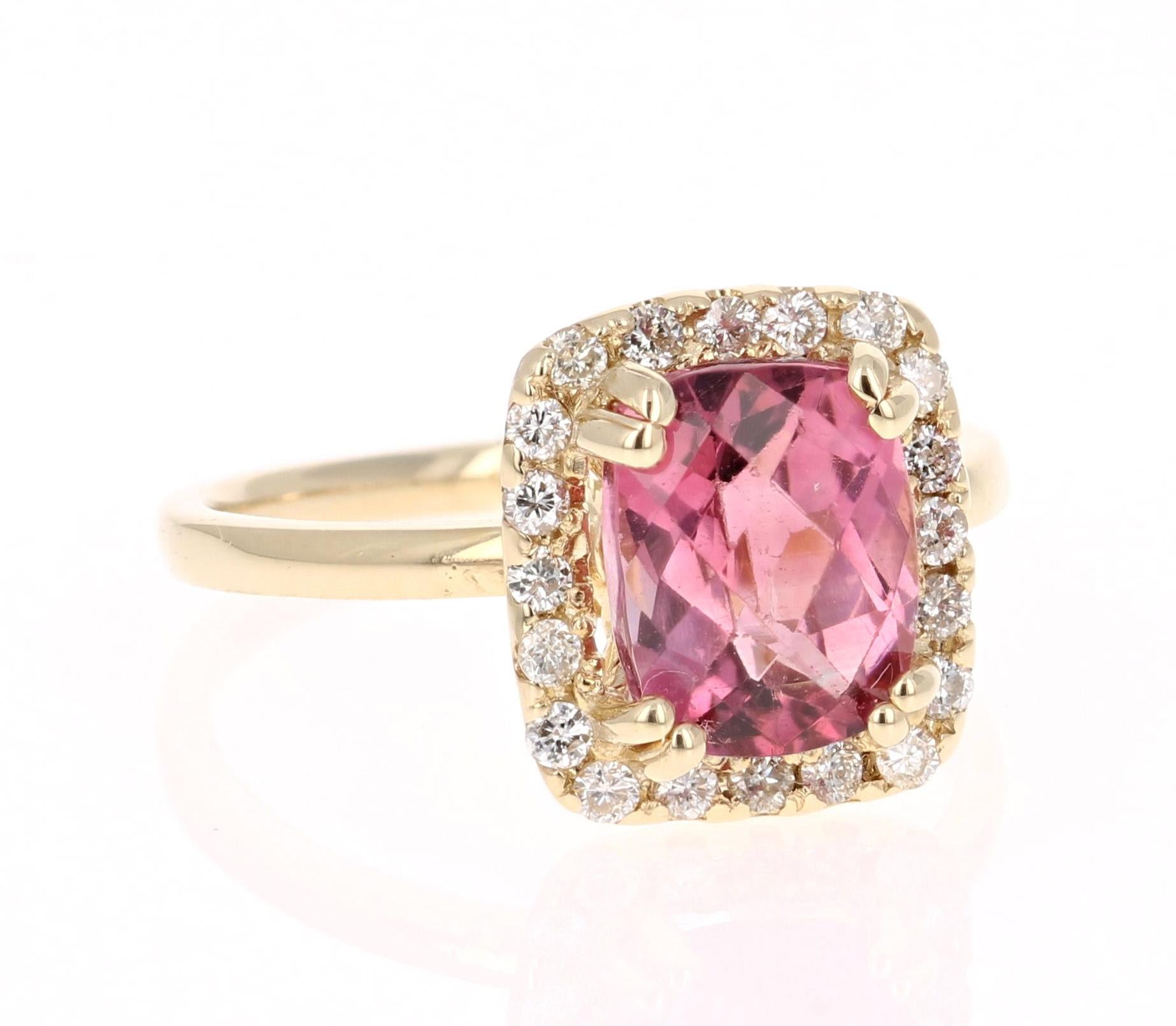 This ring has a Cushion Checkered Cut Pink Tourmaline that weighs 2.57 Carats. Floating around the tourmaline are 21 Round Cut Diamonds weighing 0.29 Carats. (VS/H) 
The total carat weight of the ring is 2.86 Carats. 
The measurements of the