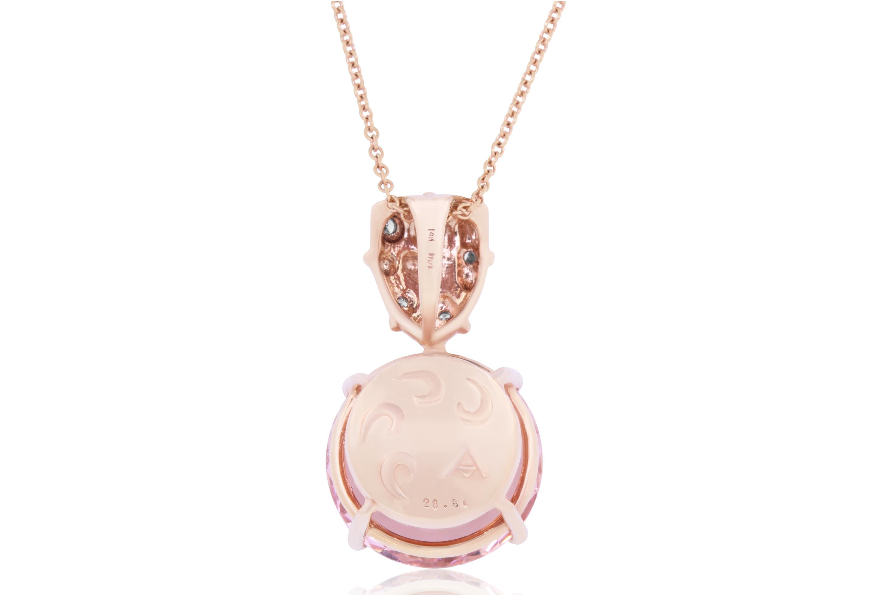 A stunning piece, this pendant features a round pink morganite set in 14K Rose gold and adorned with 6 dazzling diamonds. 

Material: 14k Rose Gold 
Center Stone Details: 28.64 Carat Roun Cut Morganite 6.7 x 8.7 mm
Mounting Stone Details: 6