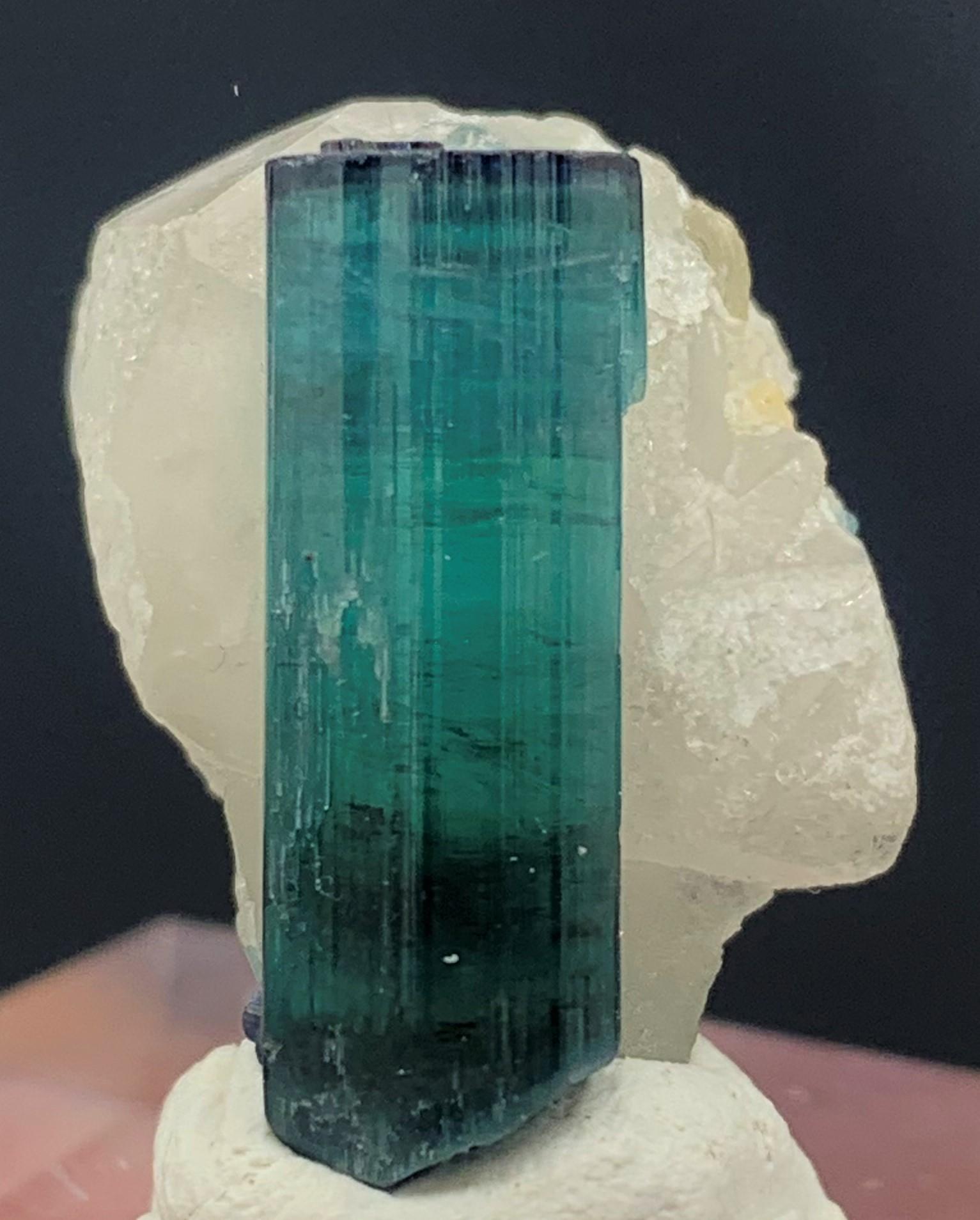 Attractive Indicolite Tourmaline Specimen From Kunar, Afghanistan 
WEIGHT: 28.65 Carat
DIMENSIONS: 2,1 x 1.6 x 1.3 Cm
ORIGIN: Kunar, Afghanistan
TREATMENT : None

Tourmaline is an extremely popular gemstone; the name Tourmaline is derived from