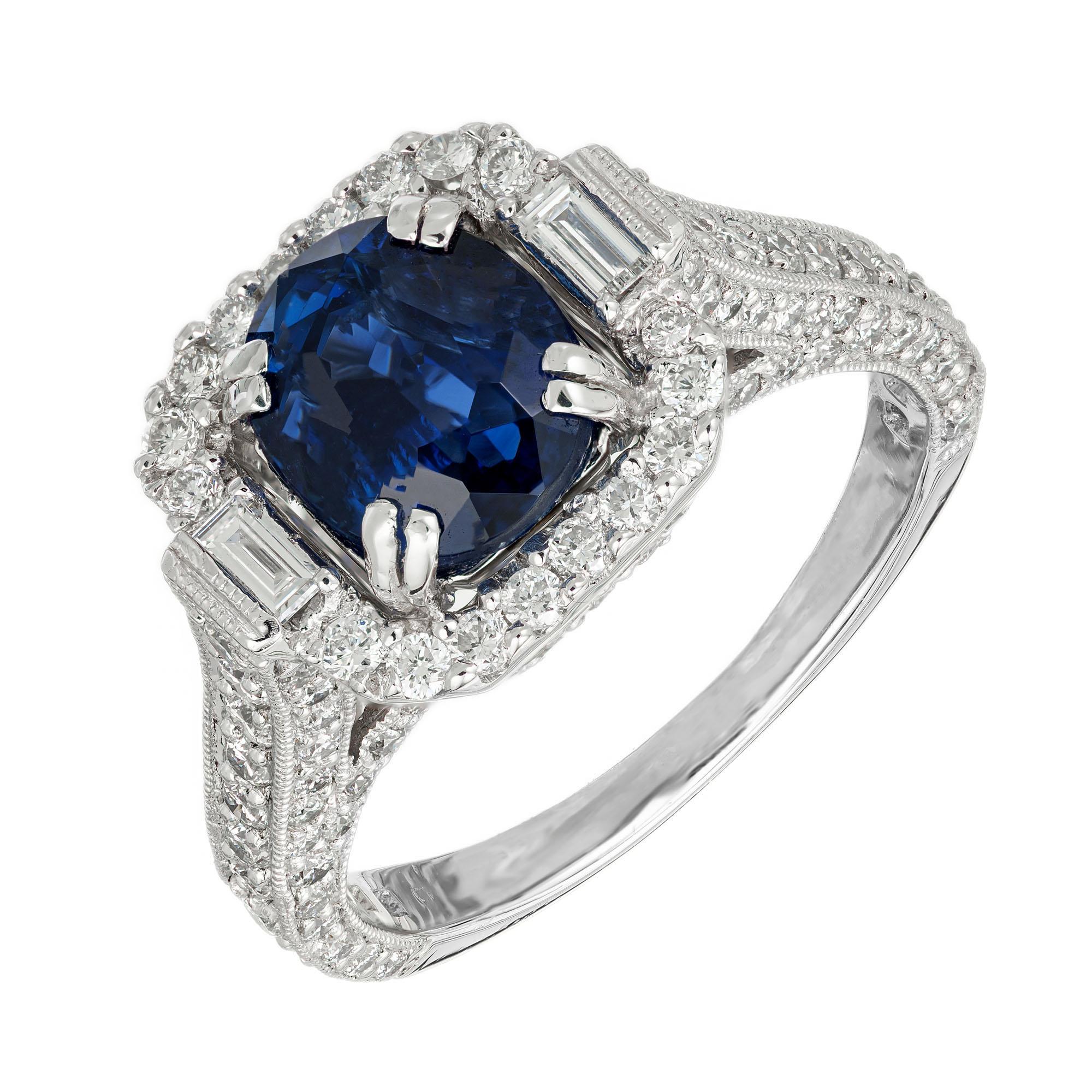 1940's late Art Deco Sapphire and diamond engagement ring. AGL certified natural oval center stone with a halo of round and baguette cut diamonds in a platinum Art Deco style setting with round diamonds along both sides of the shank. 

1 fine