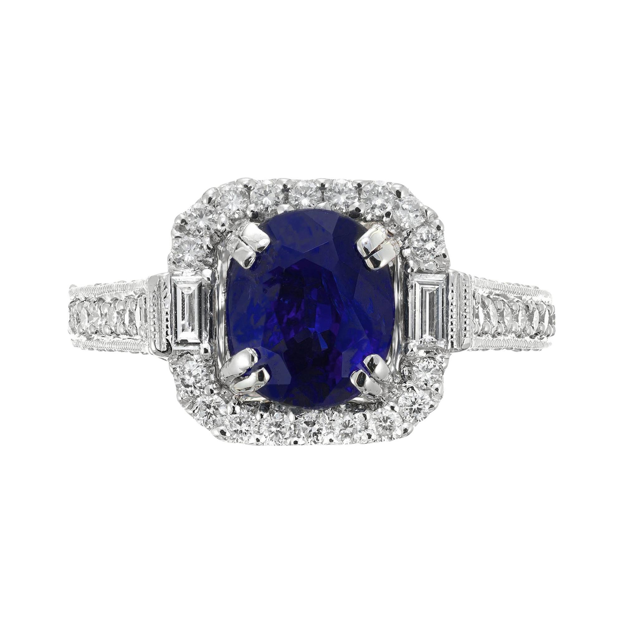 Anillo de compromiso de platino con halo de diamantes y zafiro azul oval de 2,87 quilates