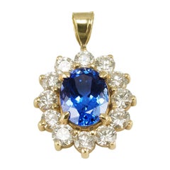 2.87 Carat Oval Tanzanite and Diamond Yellow Gold Pendant