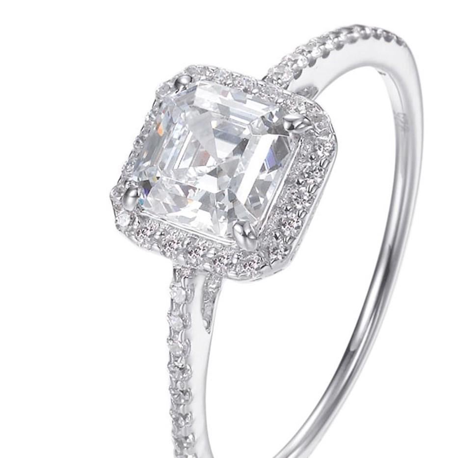 This spectacular ring oozes charm and elegance.  It's centre stone is a breath-taking 2.87ct princess cut surrounded by a halo of 0.87ct smaller brilliant cuts.

Set in 925 sterling silver with a high gloss white rhodium finish.

Whether you're